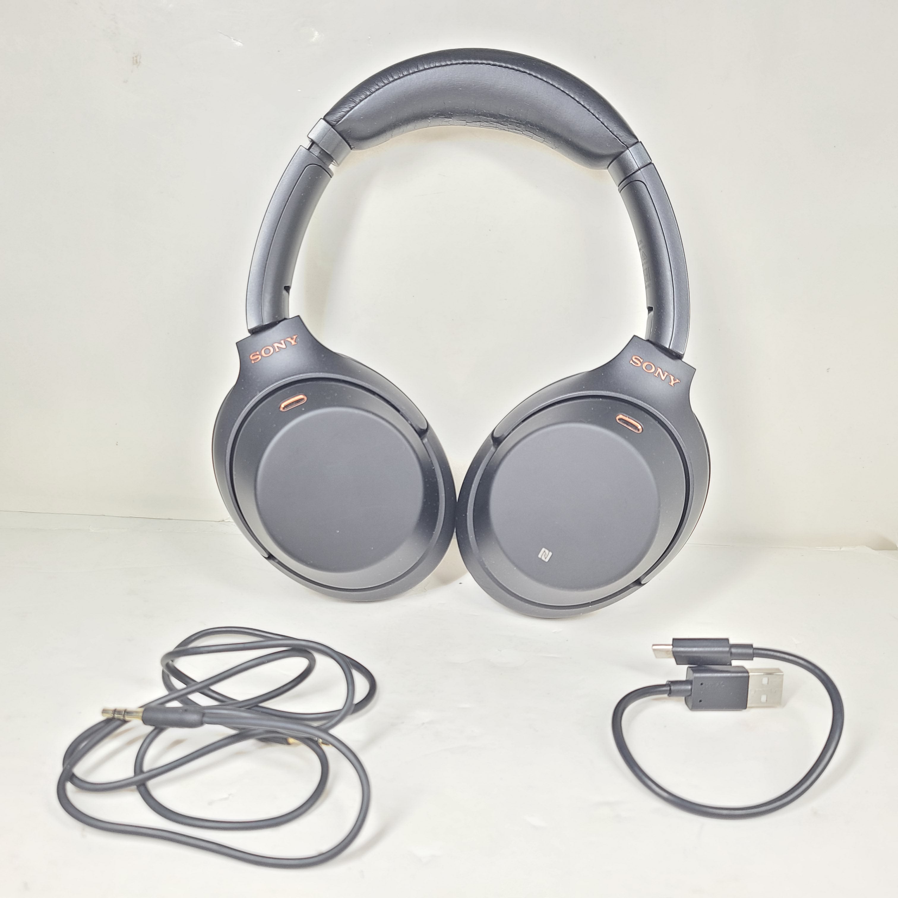 Black Sony WH-1000XM3 wireless over-ear headphones with active noise cancellation and cushioned ear pads for extended comfort.