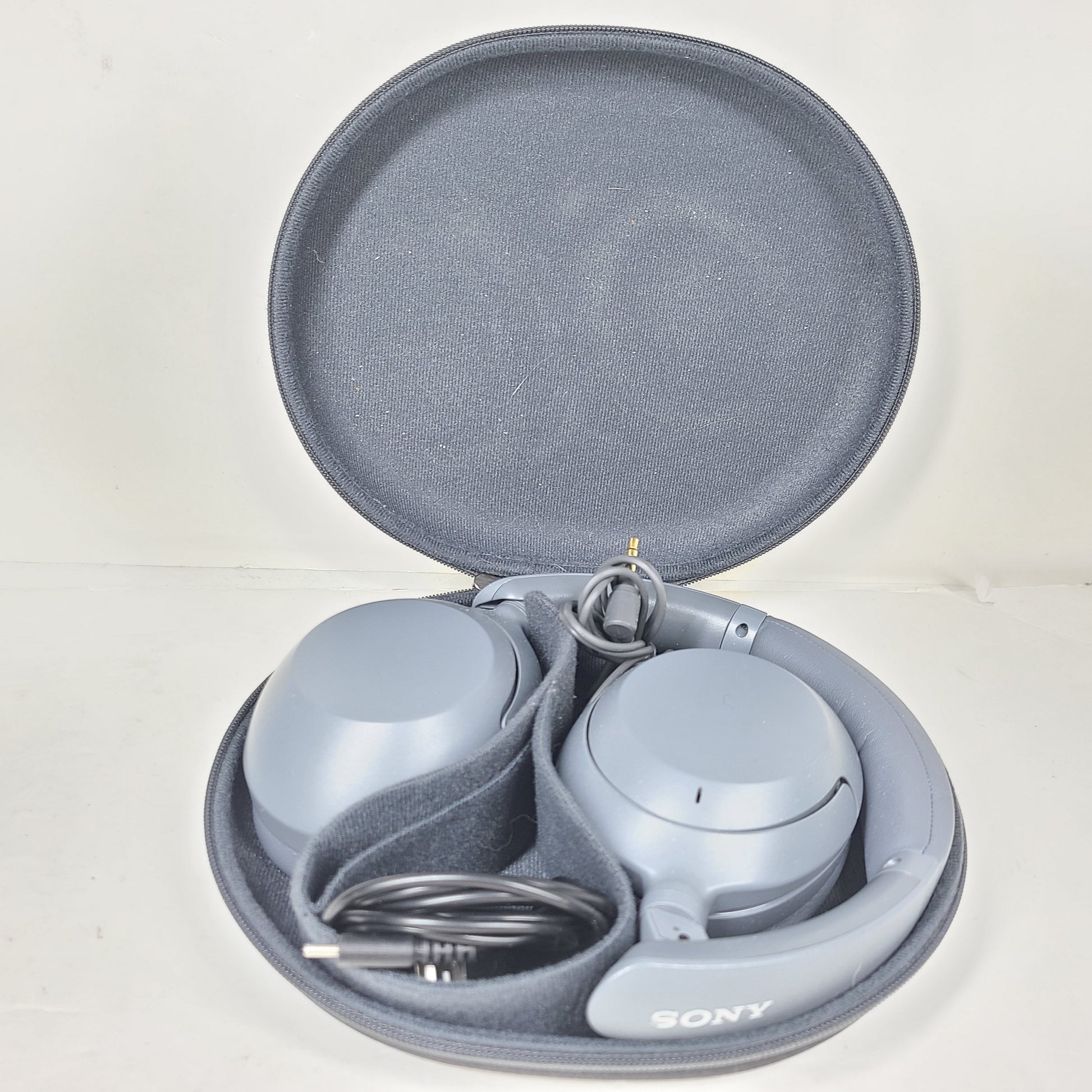 Over-ear Sony WH-CH710N headphones in gray with wireless noise-cancelling design and cushioned headband.