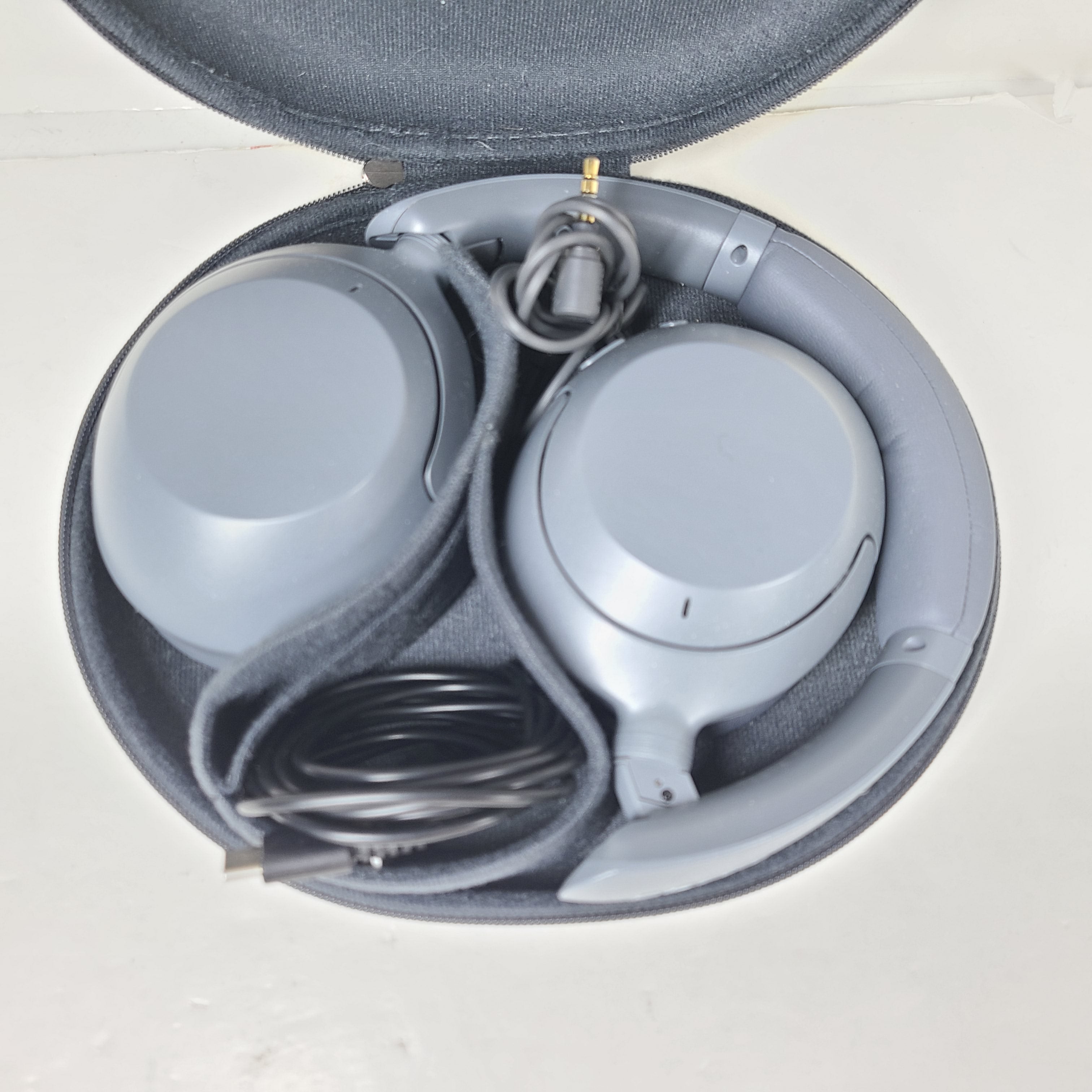 Over-ear Sony WH-CH710N headphones in gray with wireless noise-cancelling design and cushioned headband.