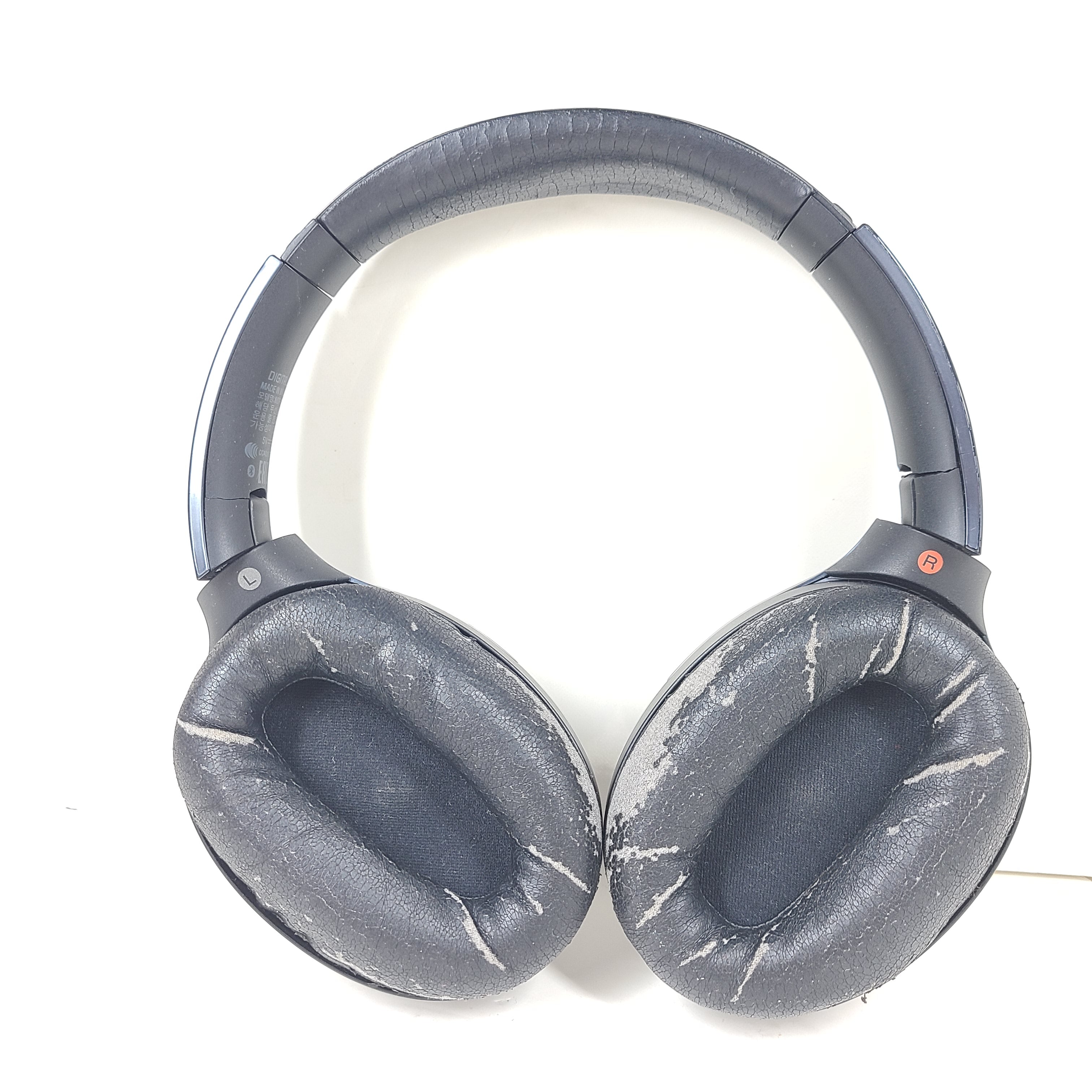 Over-ear Sony MDR-1000X headphones with active noise cancellation and a black finish.