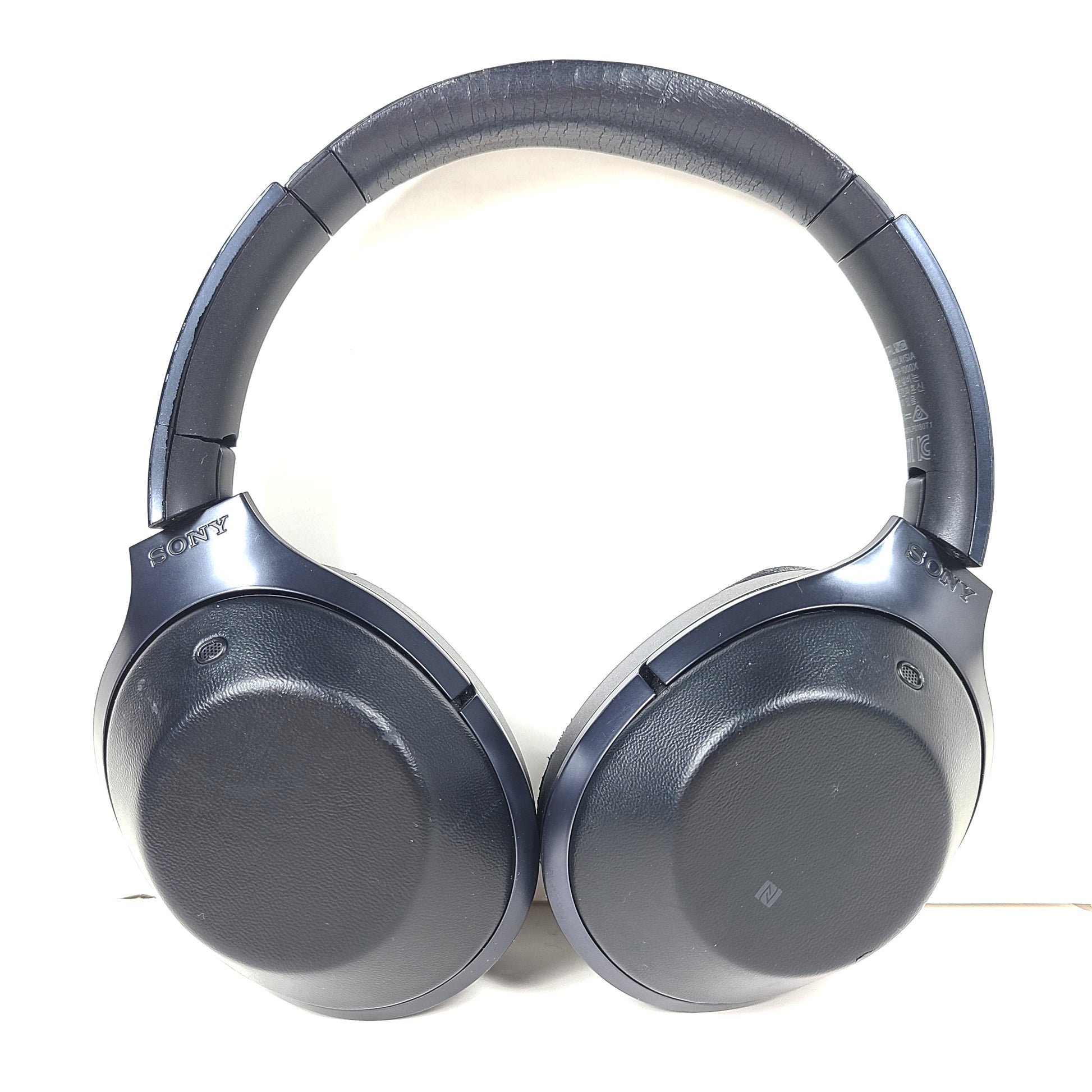 Over-ear Sony MDR-1000X headphones with active noise cancellation and a black finish.