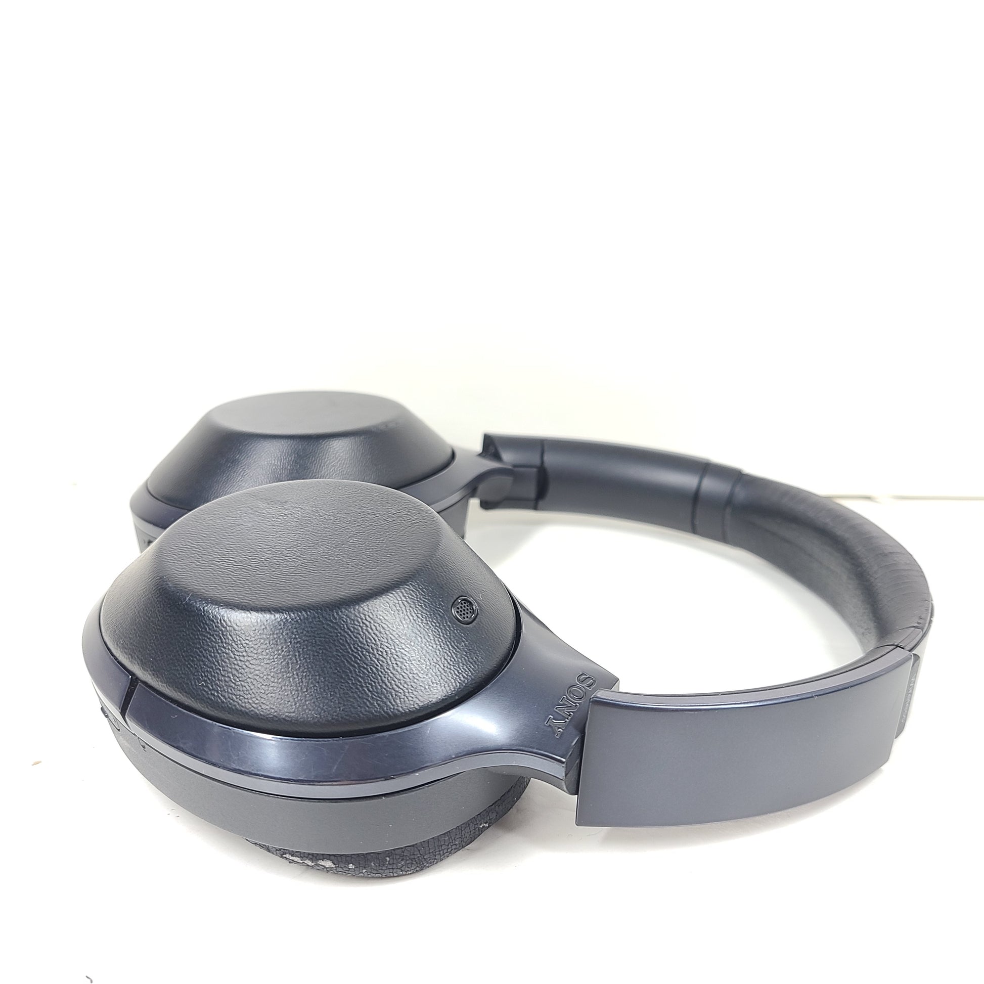 Over-ear Sony MDR-1000X headphones with active noise cancellation and a black finish.