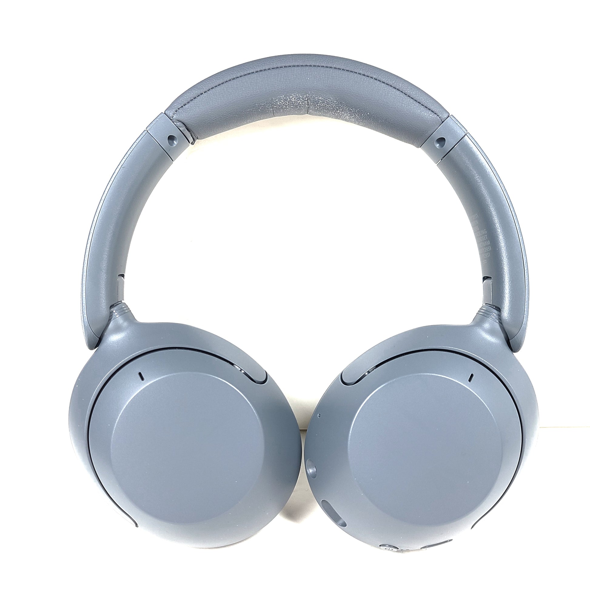 Premium wireless over-ear headphones with active noise cancellation and a cushioned headband in gray.