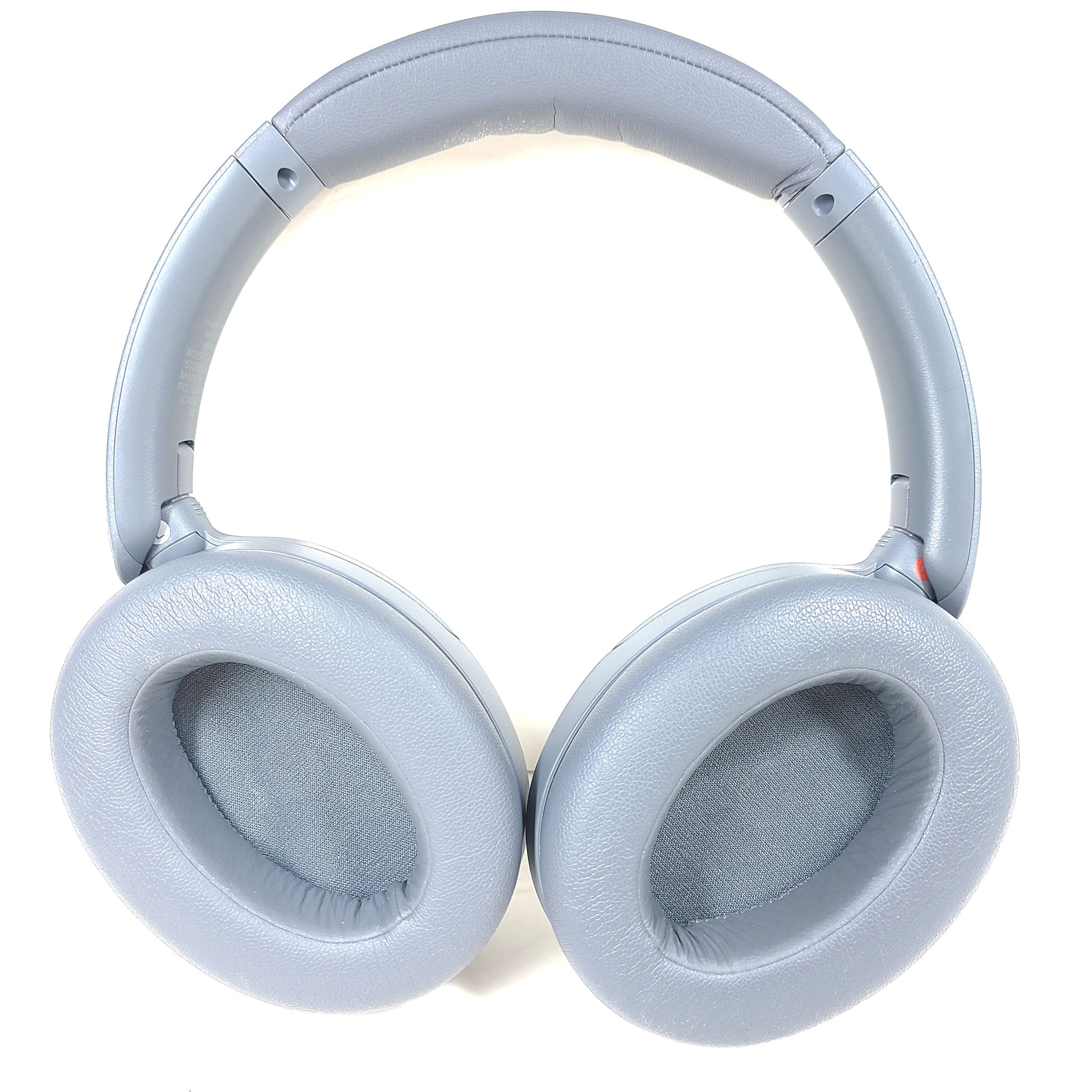 Premium wireless over-ear headphones with active noise cancellation and a cushioned headband in gray.