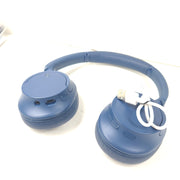 Blue Sony WH-CH720N wireless noise-cancelling over-ear headphones with padded ear cups and adjustable headband.
