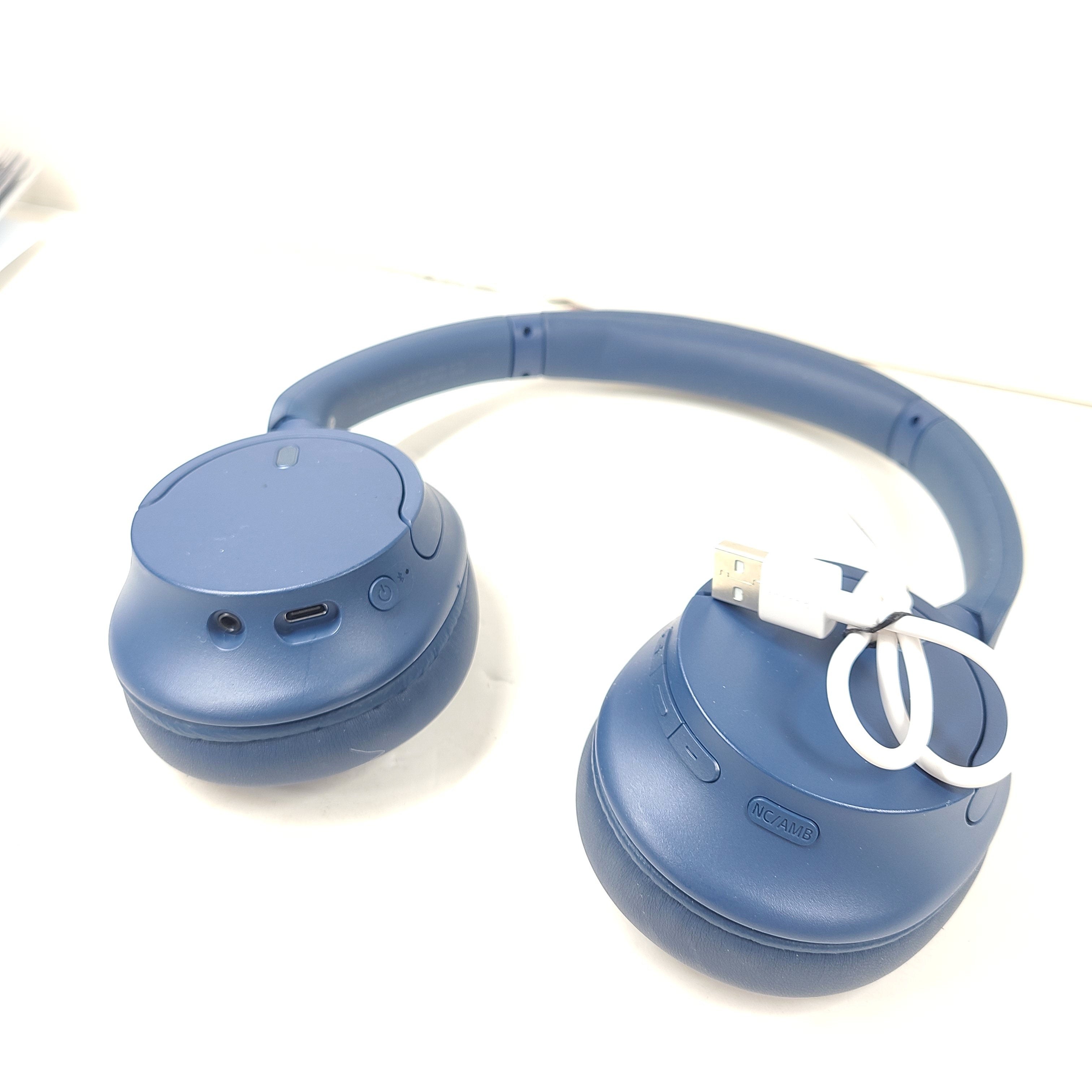 Blue Sony WH-CH720N wireless noise-cancelling over-ear headphones with padded ear cups and adjustable headband.