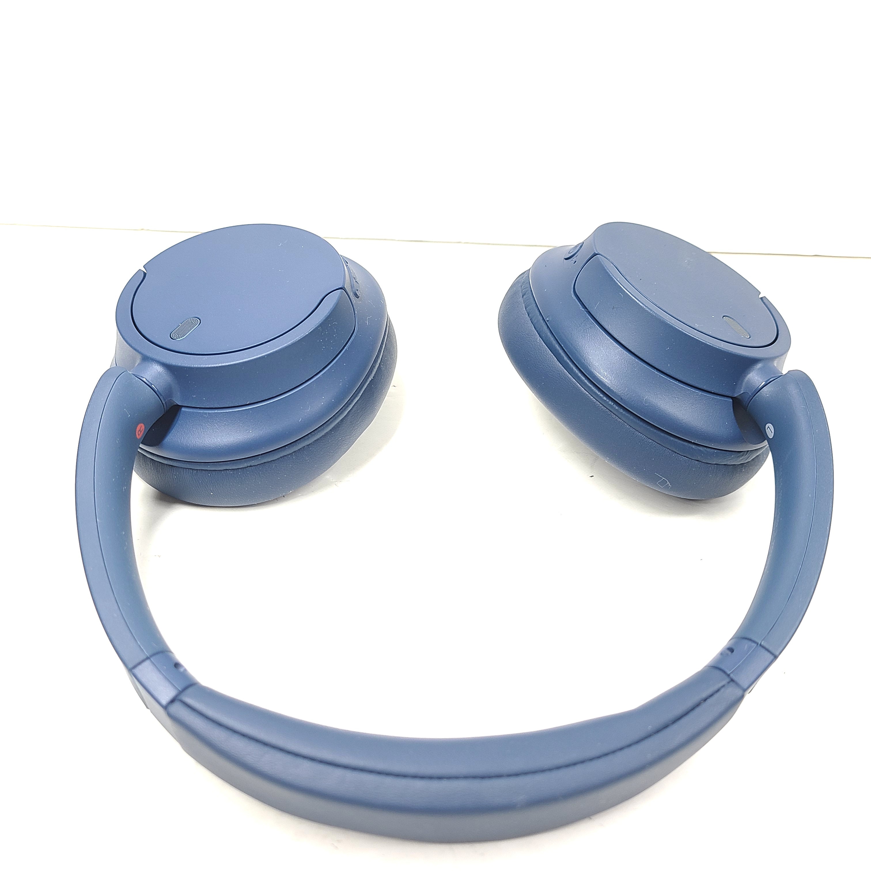 Blue Sony WH-CH720N wireless noise-cancelling over-ear headphones with padded ear cups and adjustable headband.