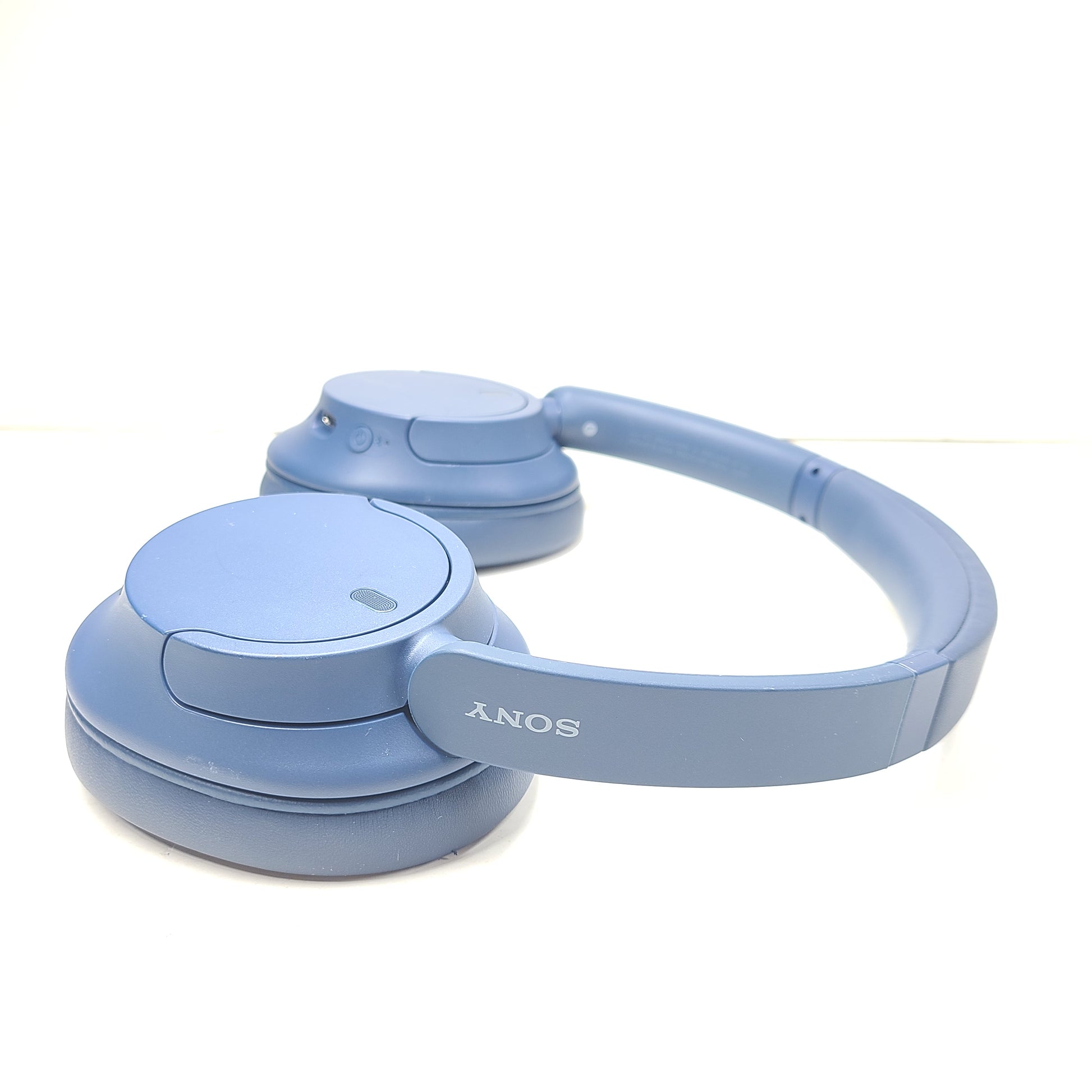 Blue Sony WH-CH720N wireless noise-cancelling over-ear headphones with padded ear cups and adjustable headband.