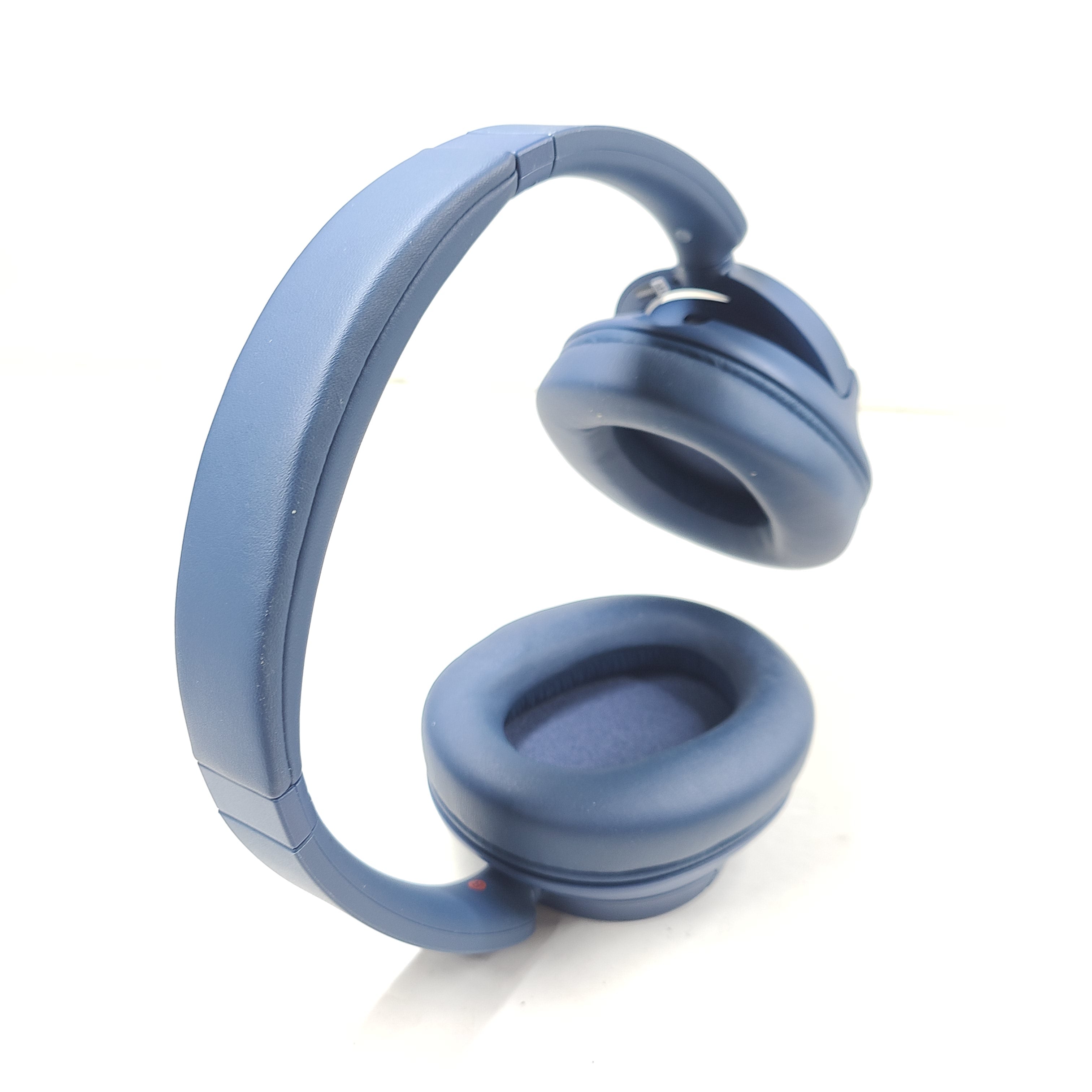 Blue Sony WH-CH720N wireless noise-cancelling over-ear headphones with padded ear cups and adjustable headband.