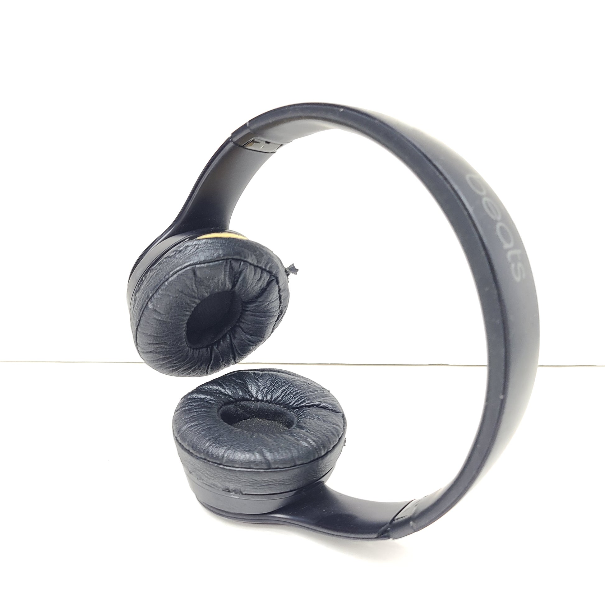 Black Beats Solo3 Wireless on-ear headphones with cushioned ear cups and adjustable headband.