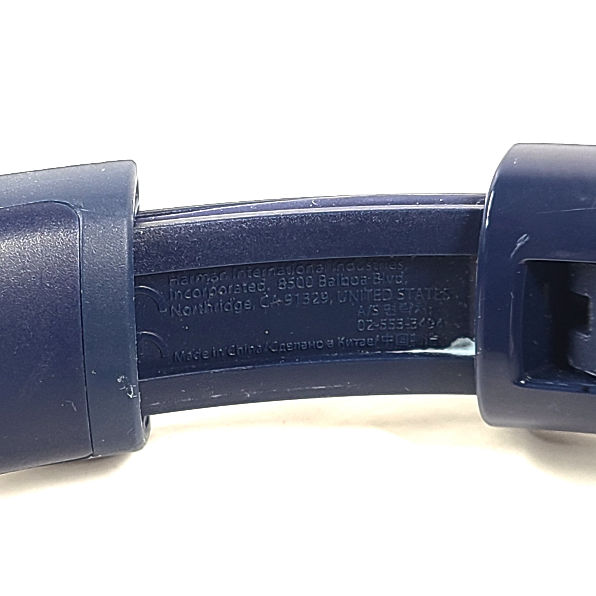 Blue JBL TUNE700BT wireless over-ear headphones with cushioned earcups and adjustable headband.