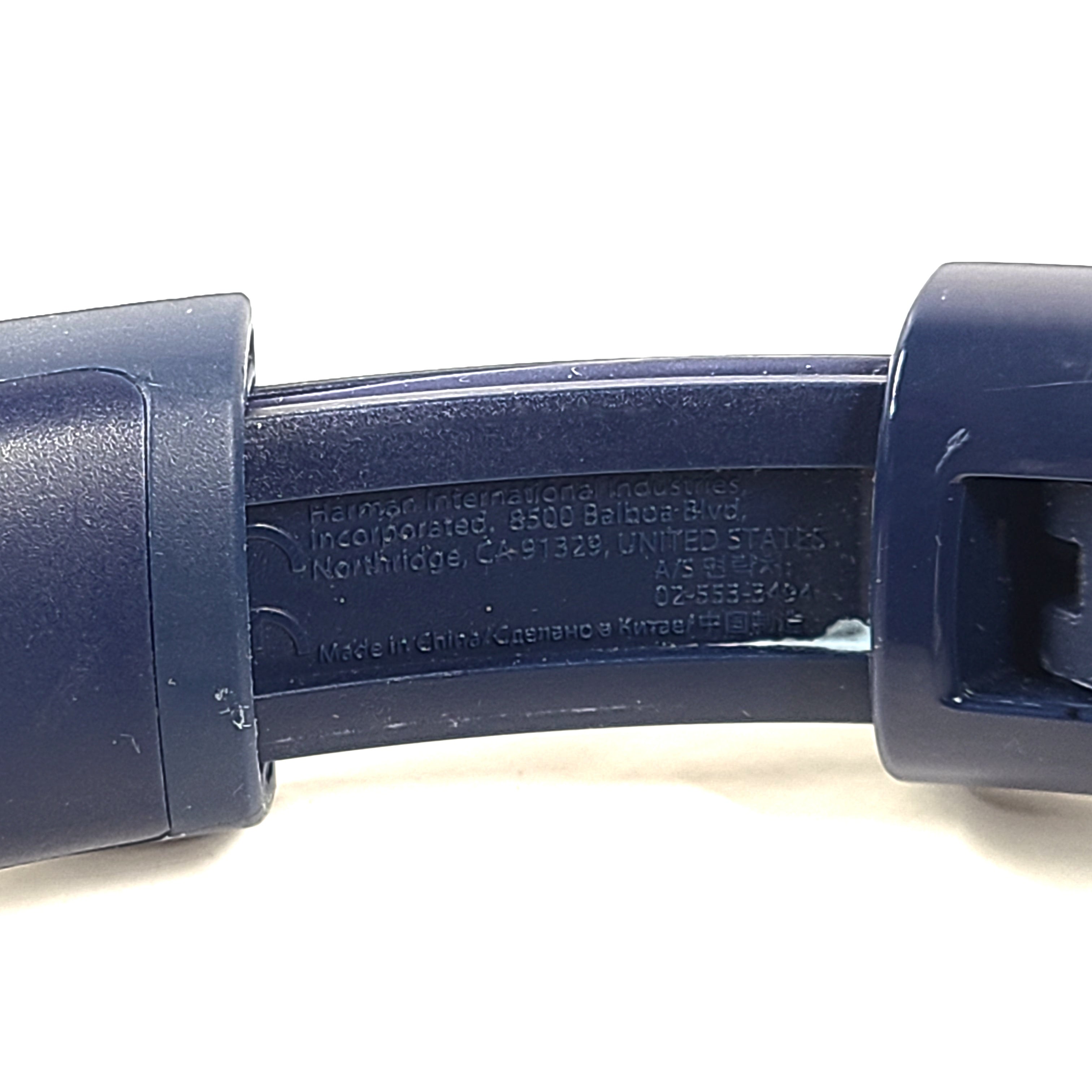 Blue JBL TUNE700BT wireless over-ear headphones with cushioned earcups and adjustable headband.