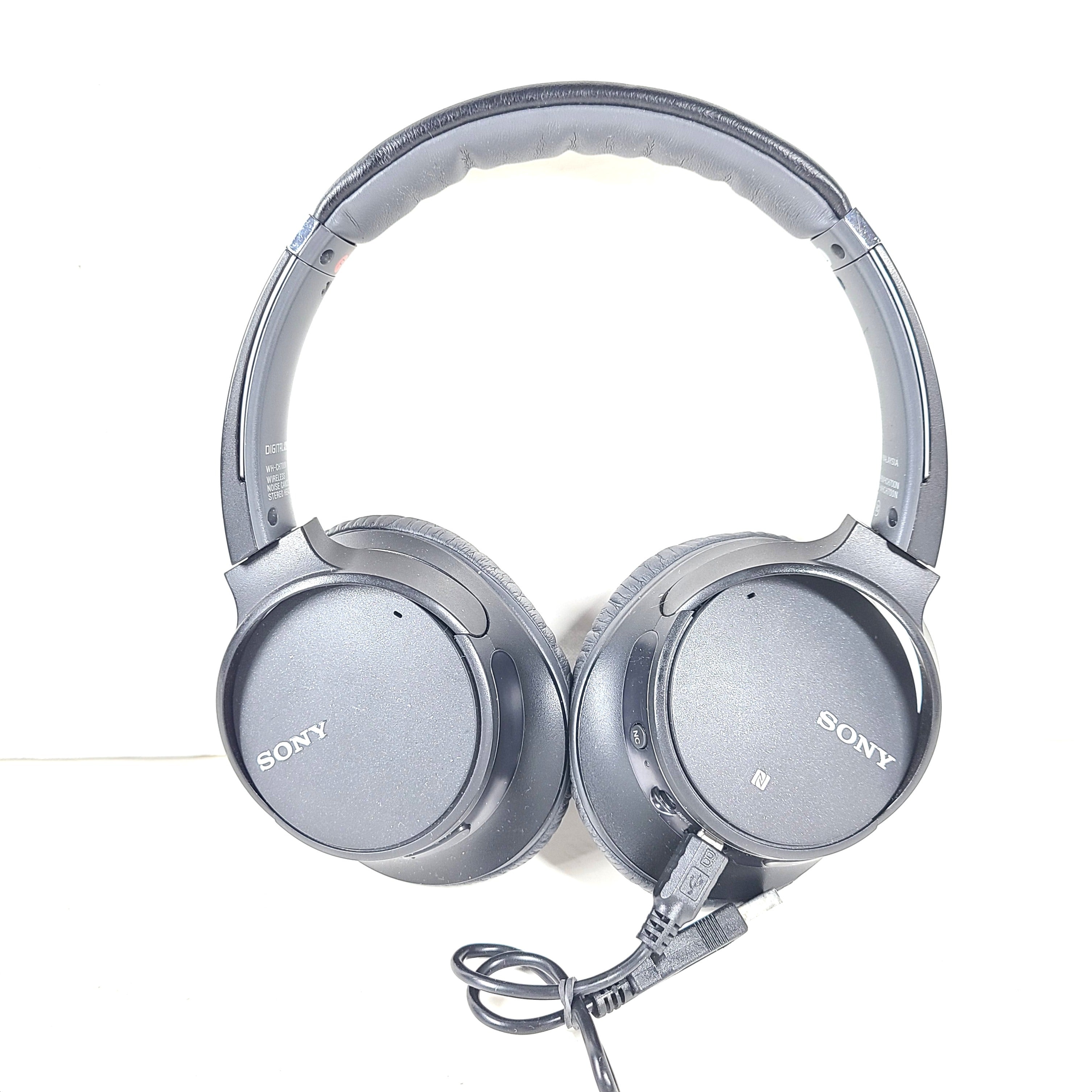 Sony WH-CH700N wireless noise-canceling over-ear headphones in dark grey with an attached 3.5mm audio cable.
