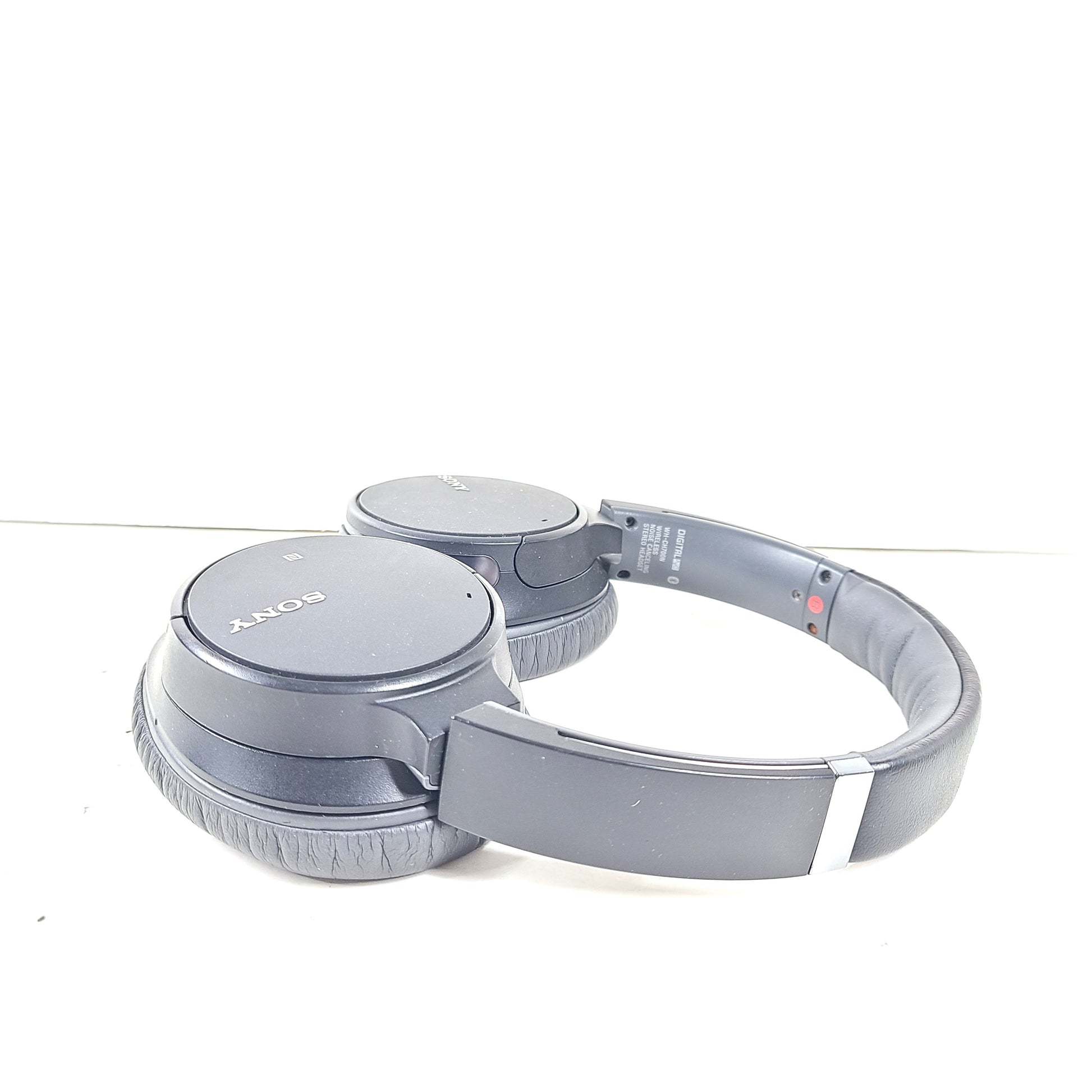 Sony WH-CH700N wireless noise-canceling over-ear headphones in dark grey with an attached 3.5mm audio cable.