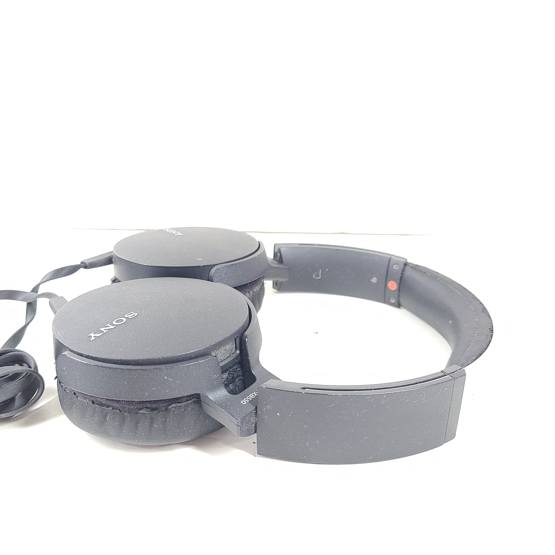 Sony MDR-XB550 wired on-ear headphones in black with cushioned headband and attached audio cable.