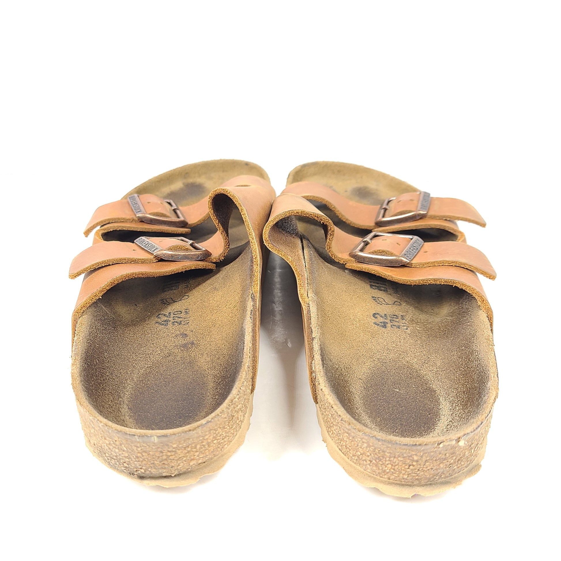 Brown Birkenstock sandals in EU size 42, model 278 with an imprint on the footbed and mild wear on straps and footbeds.