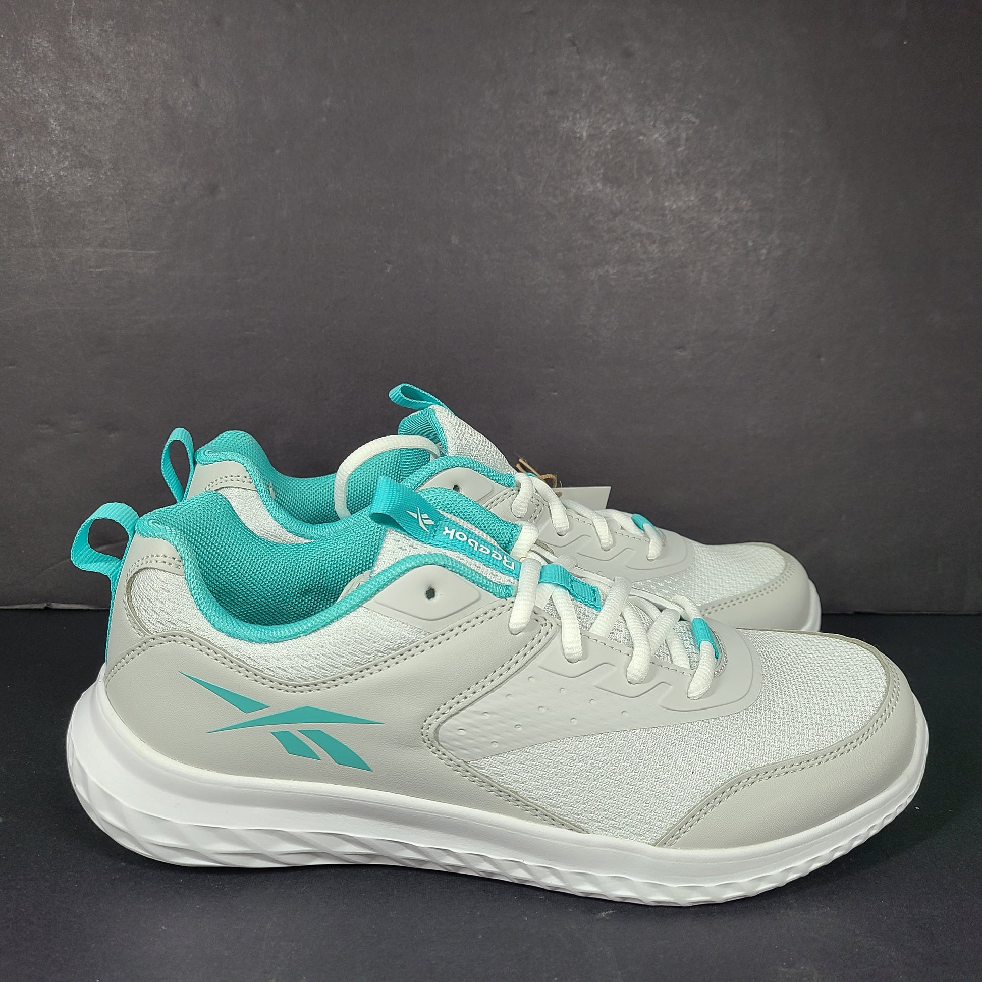 New Reebok Rush Runner 4.0 in white and teal, two pairs in US sizes 5.5 and 7.