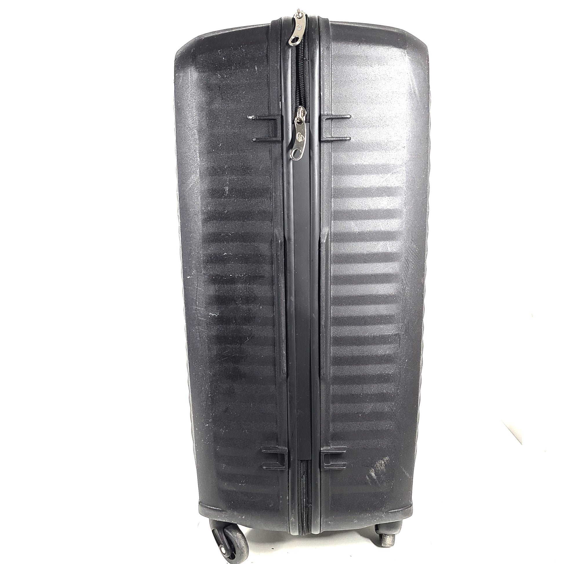 Black Kamiliant hard-shell spinner suitcase with four smooth-rolling wheels and a telescoping handle.