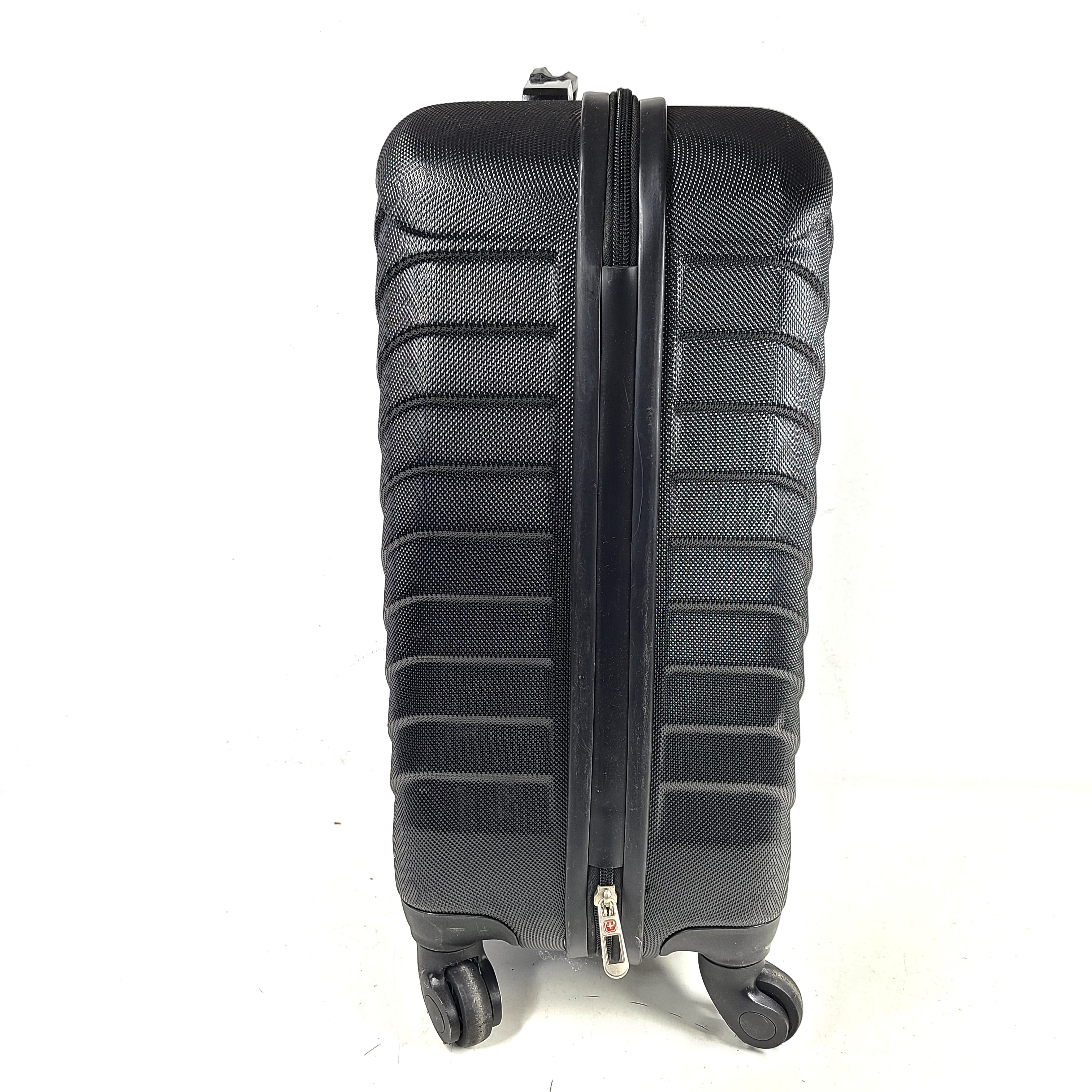 Black SwissGear suitcase with interior logo lining and scuff marks on the exterior.
