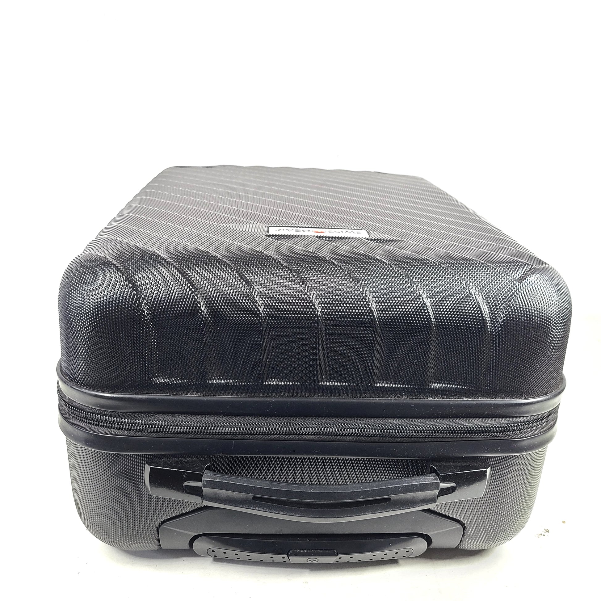 Black SwissGear suitcase with interior logo lining and scuff marks on the exterior.