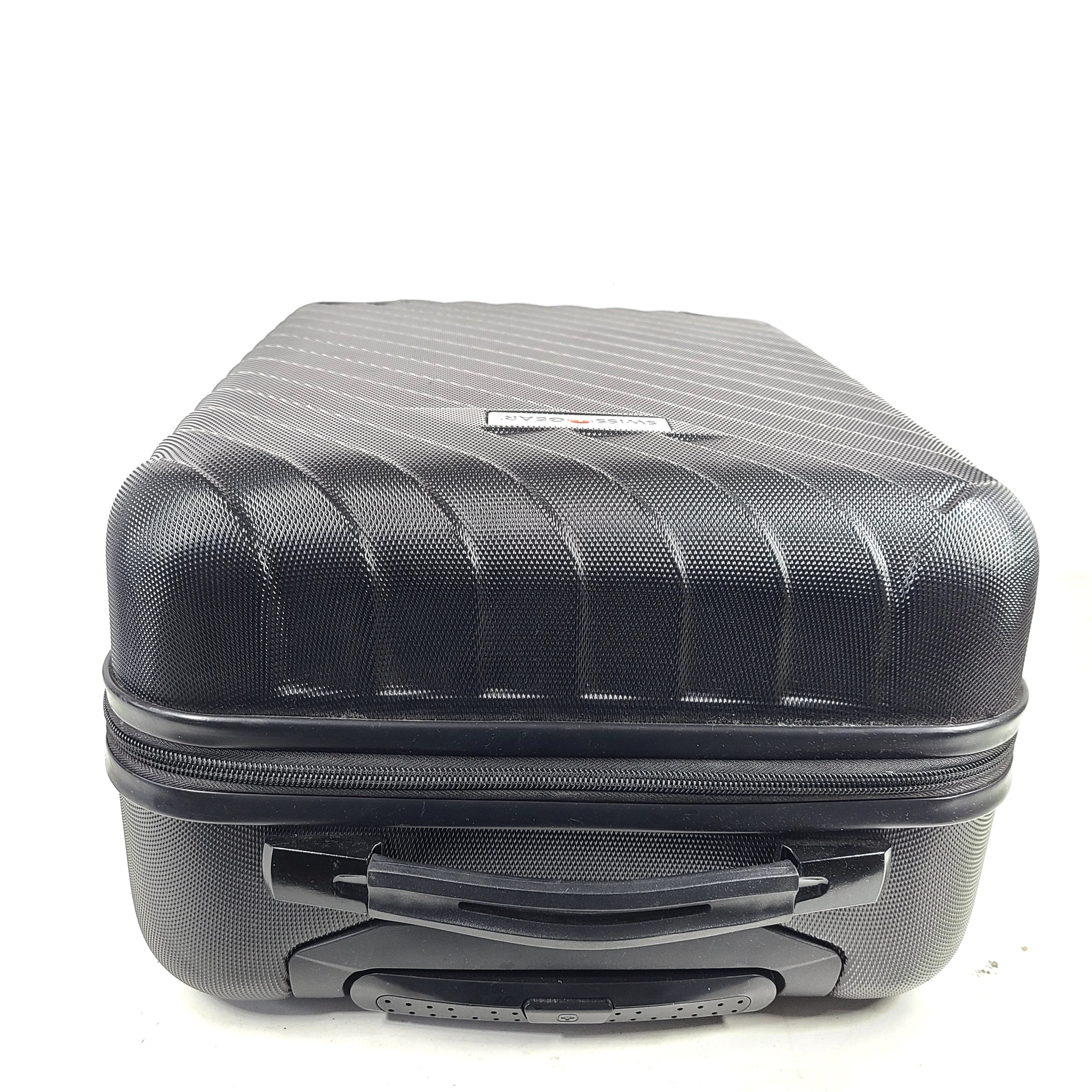 Black SwissGear suitcase with interior logo lining and scuff marks on the exterior.