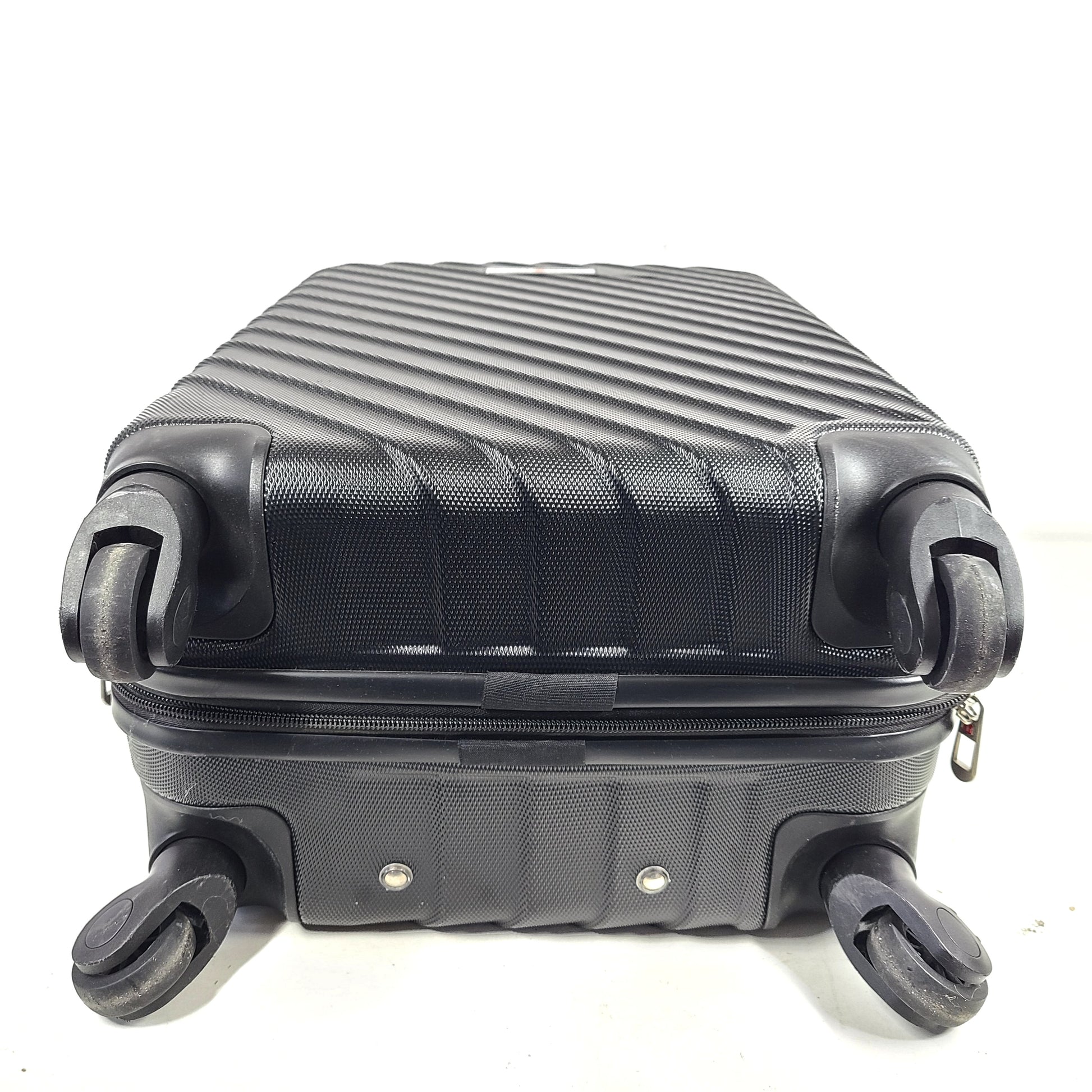 Black SwissGear suitcase with interior logo lining and scuff marks on the exterior.