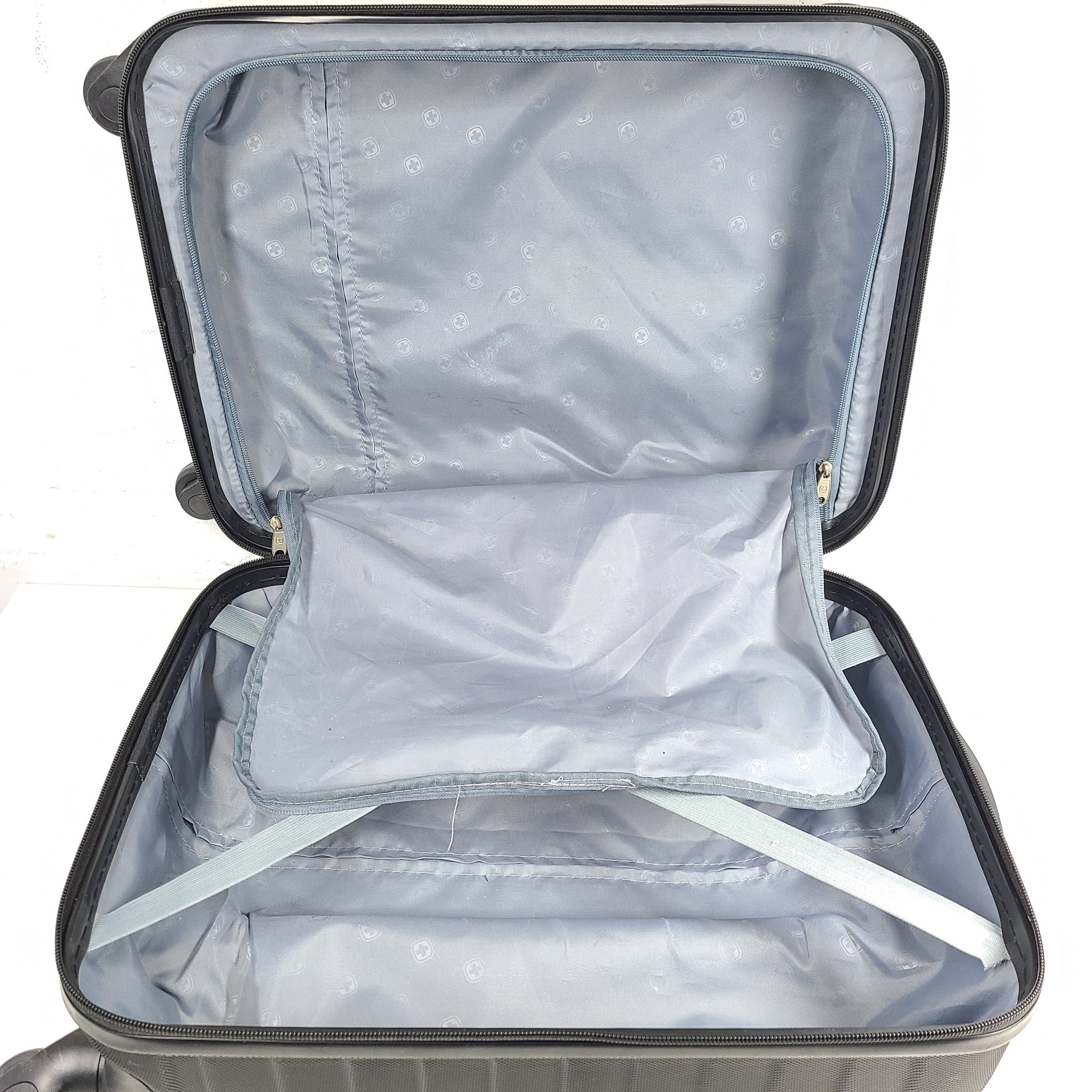 Black SwissGear suitcase with interior logo lining and scuff marks on the exterior.