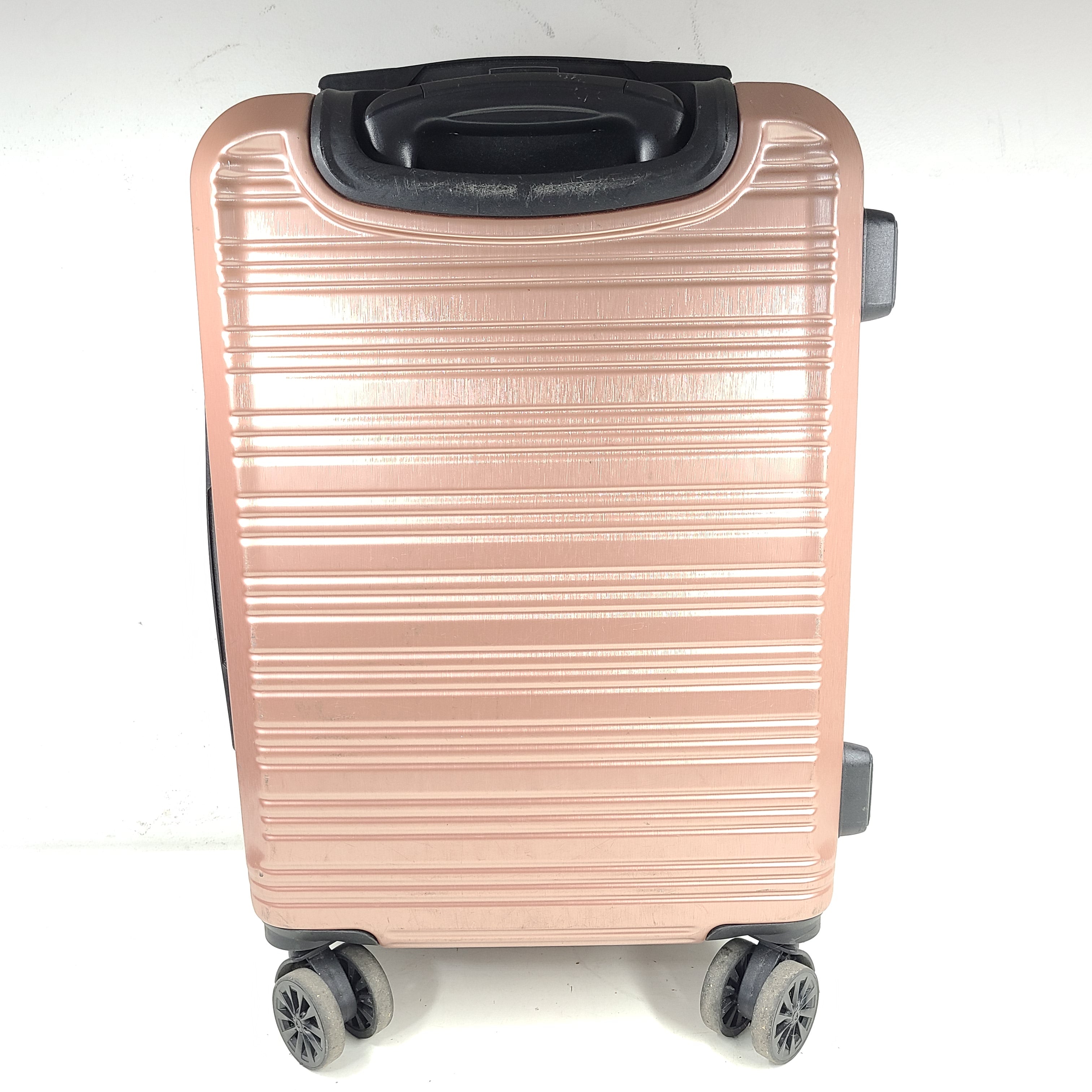 Rose gold Heys Aerolite hardshell carry-on with spinner wheels and telescoping handle for smooth travel.