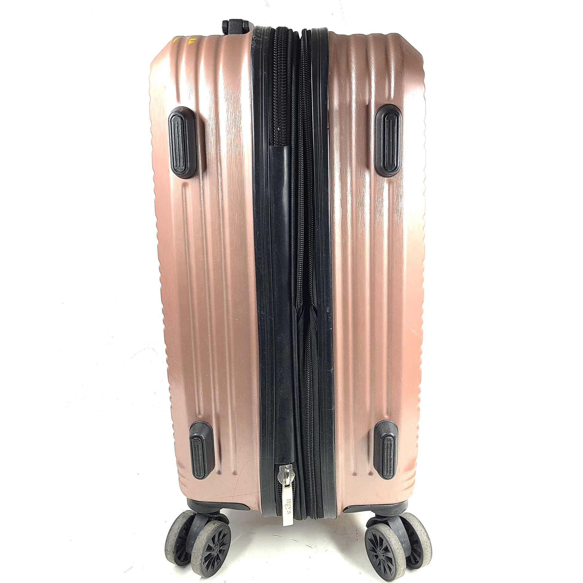 Rose gold Heys Aerolite hardshell carry-on with spinner wheels and telescoping handle for smooth travel.