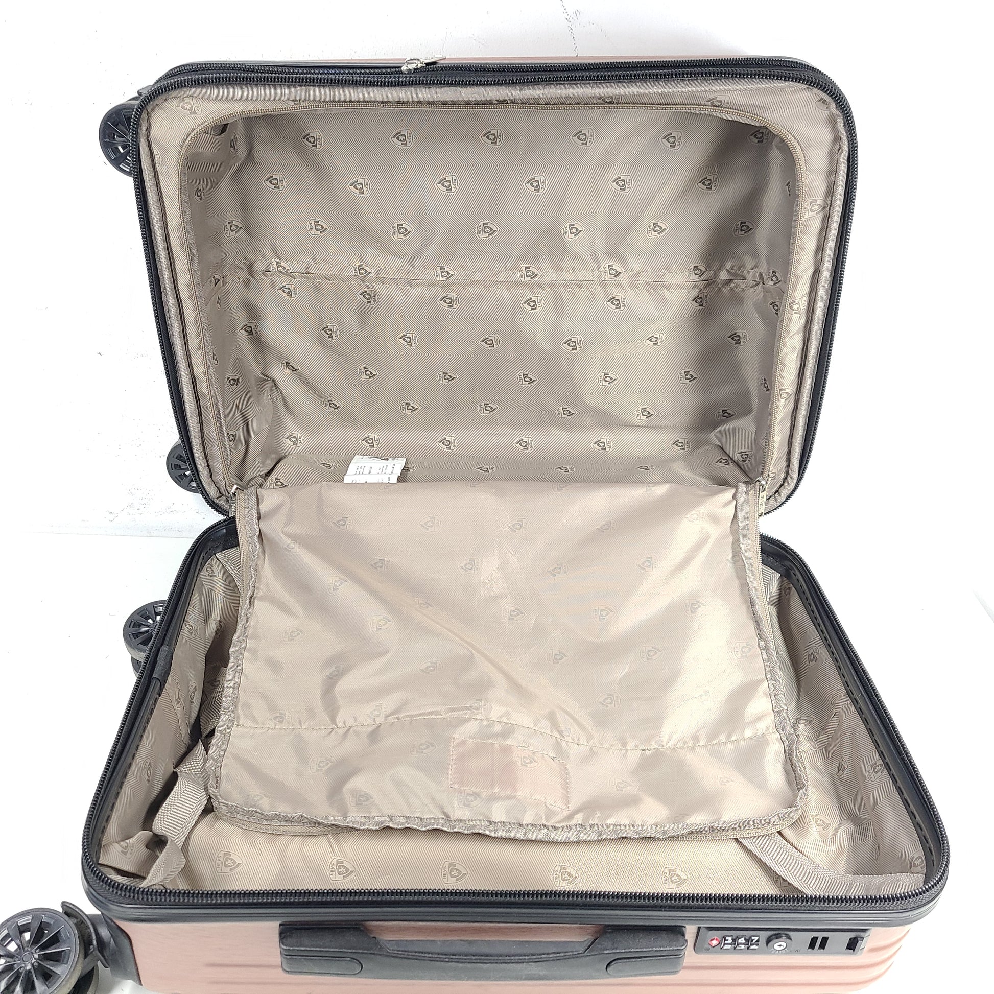 Rose gold Heys Aerolite hardshell carry-on with spinner wheels and telescoping handle for smooth travel.