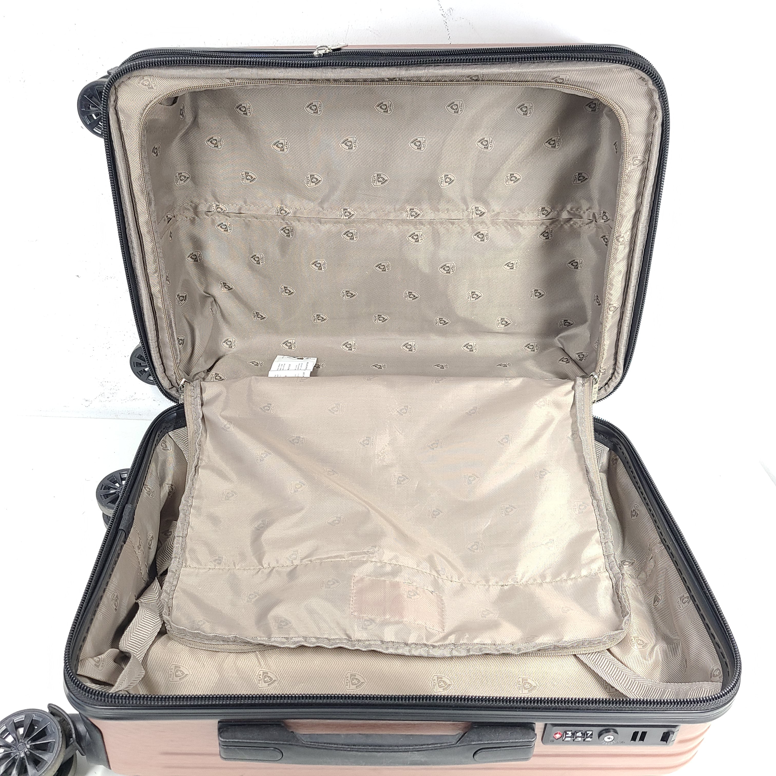 Rose gold Heys Aerolite hardshell carry-on with spinner wheels and telescoping handle for smooth travel.