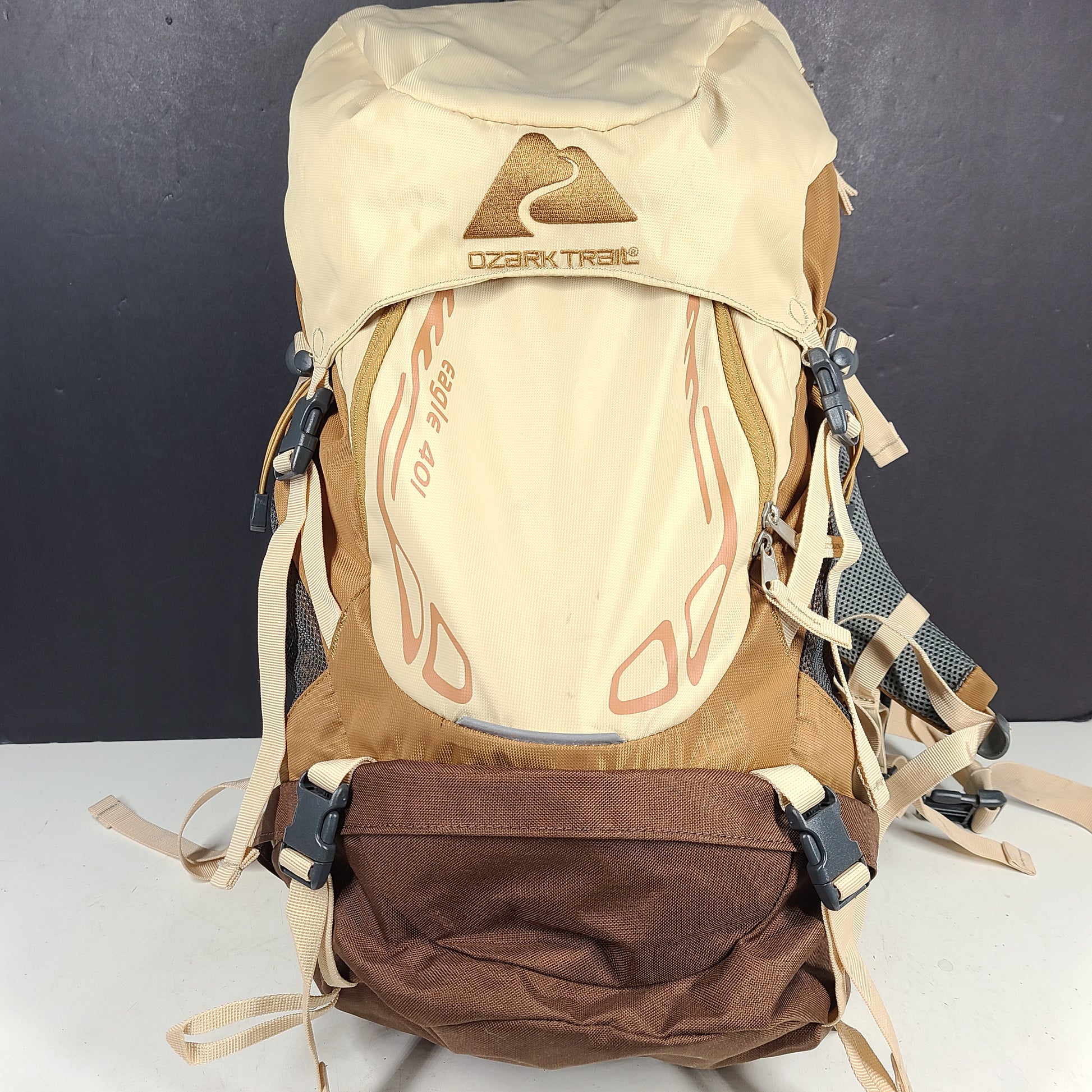 Beige and brown Ozark Trail Eagle 40L hiking backpack designed for outdoor use.