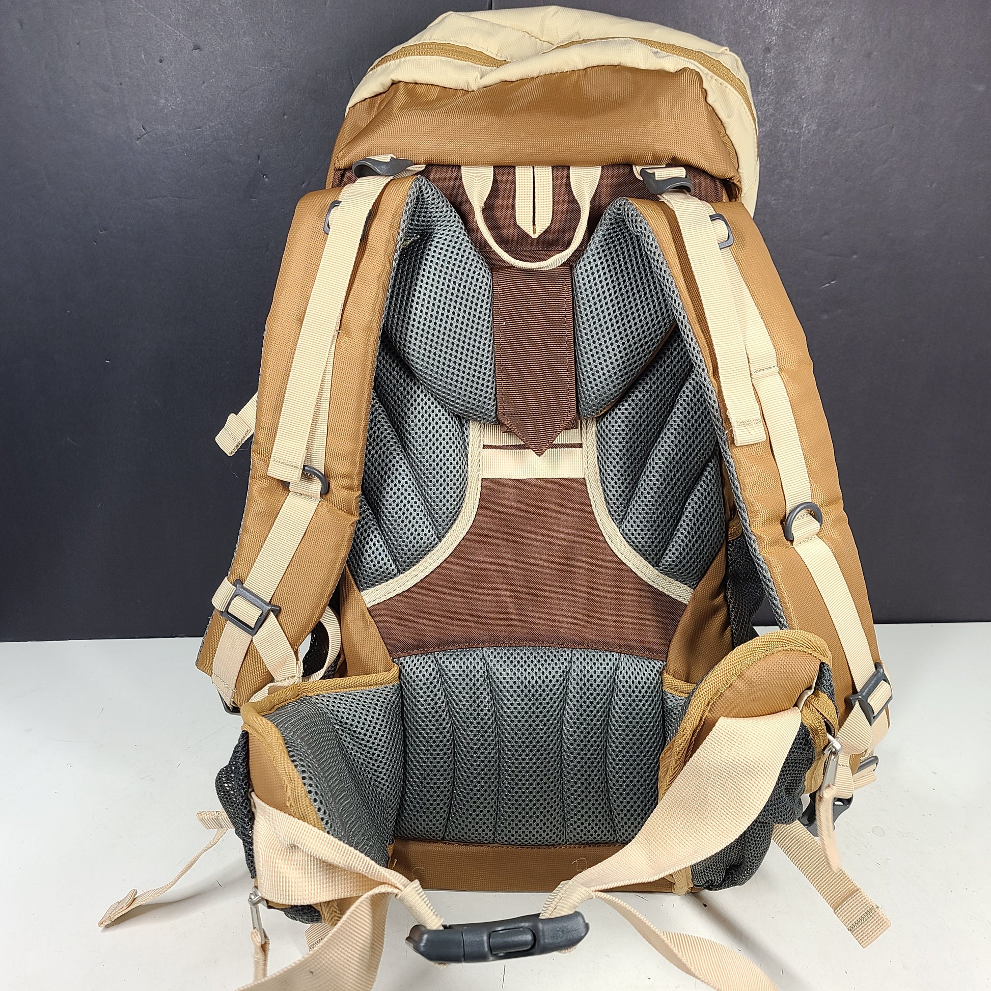 Beige and brown Ozark Trail Eagle 40L hiking backpack designed for outdoor use.