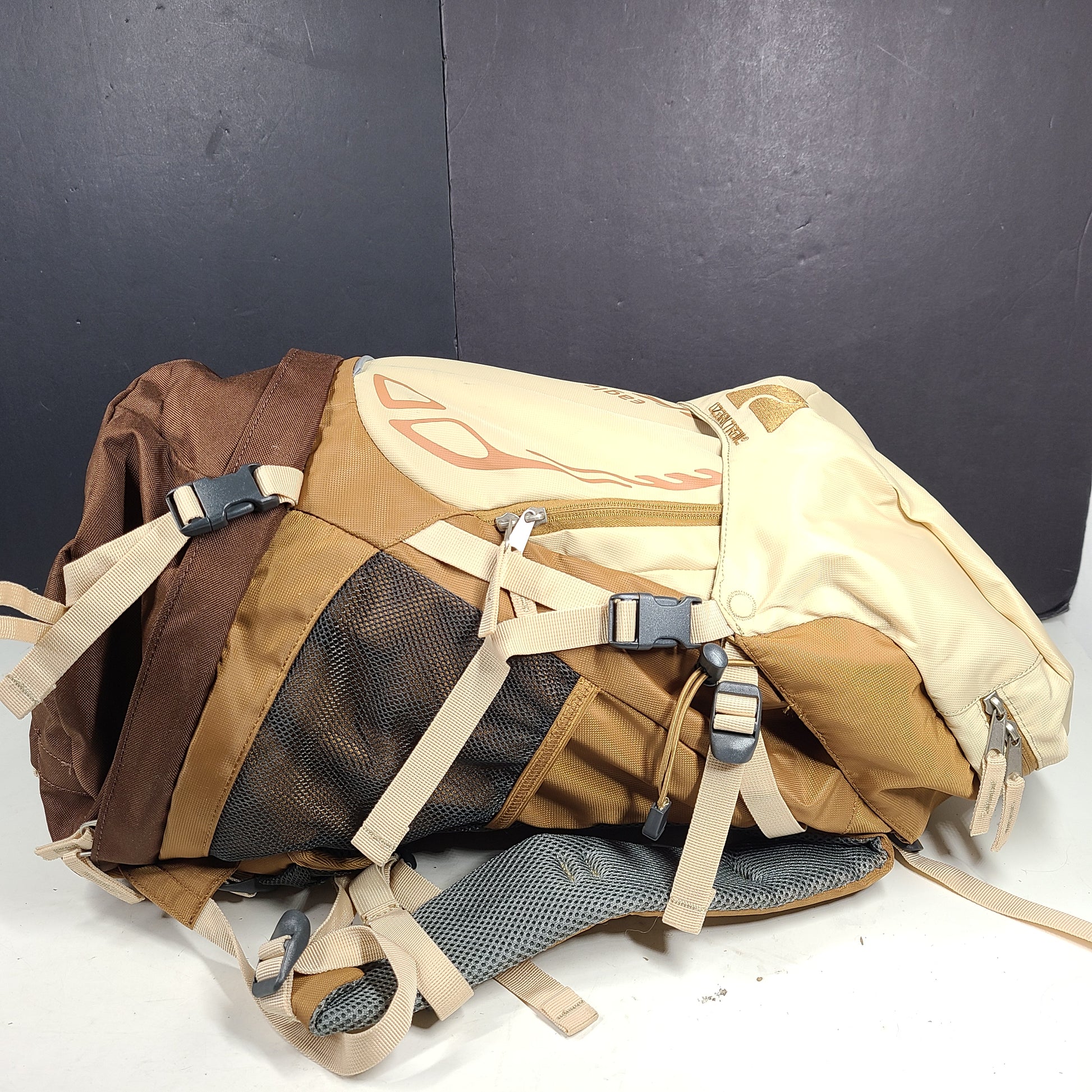 Beige and brown Ozark Trail Eagle 40L hiking backpack designed for outdoor use.