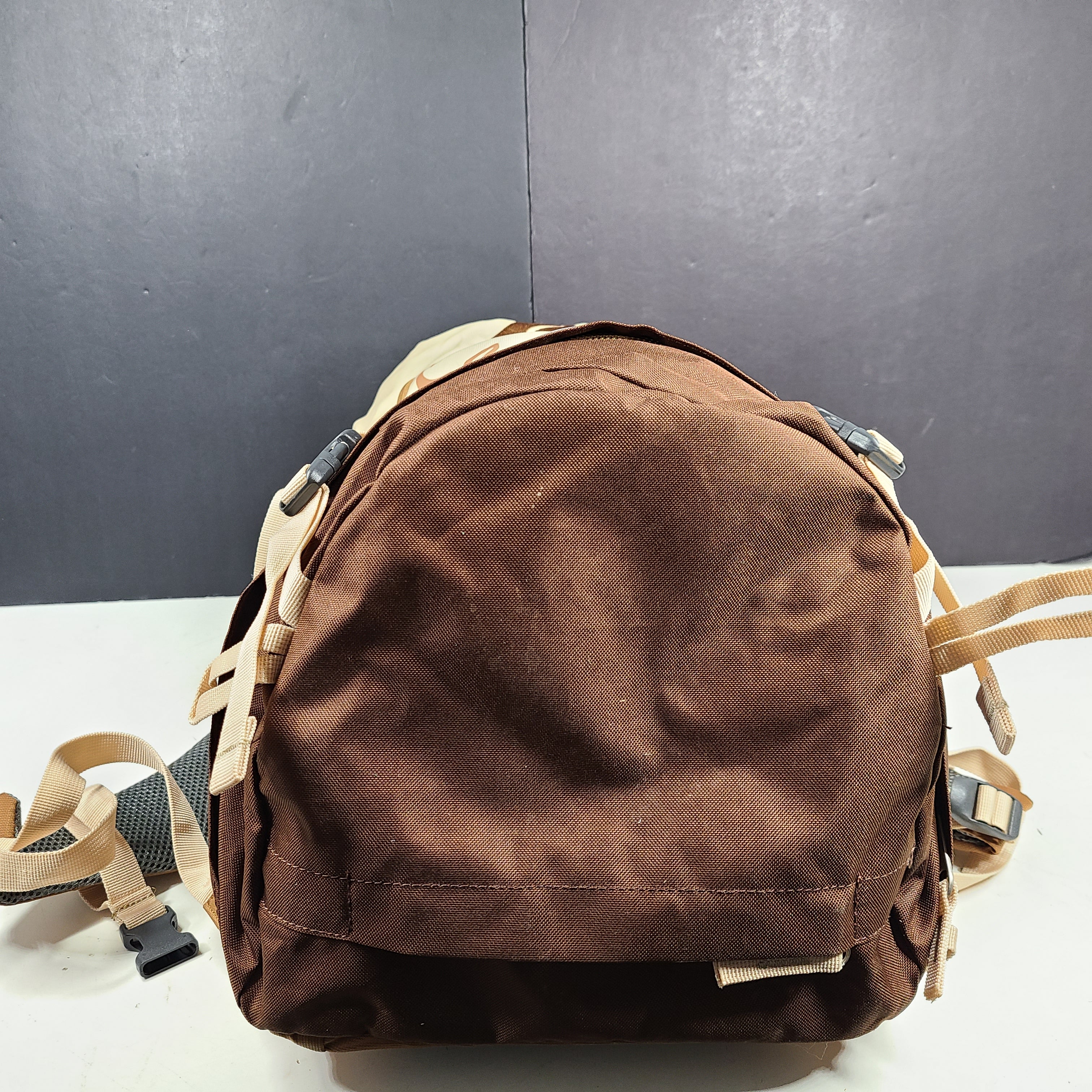 Beige and brown Ozark Trail Eagle 40L hiking backpack designed for outdoor use.