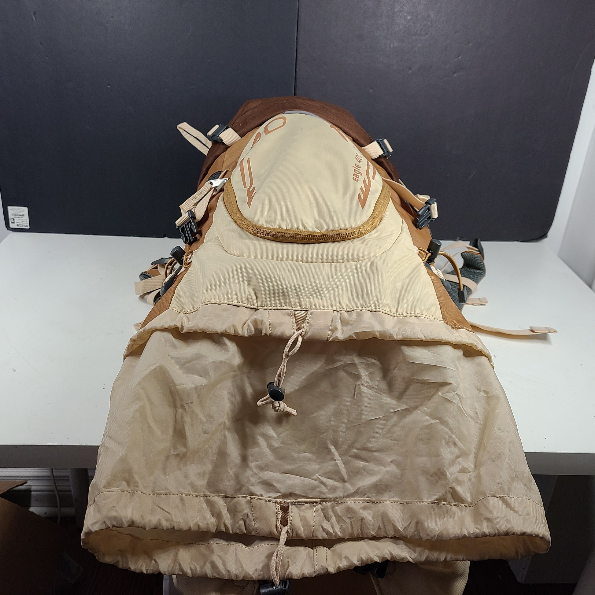 Beige and brown Ozark Trail Eagle 40L hiking backpack designed for outdoor use.