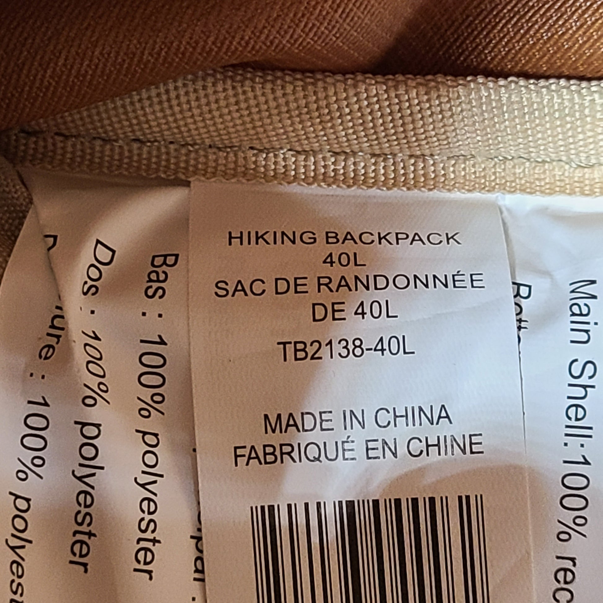 Beige and brown Ozark Trail Eagle 40L hiking backpack designed for outdoor use.