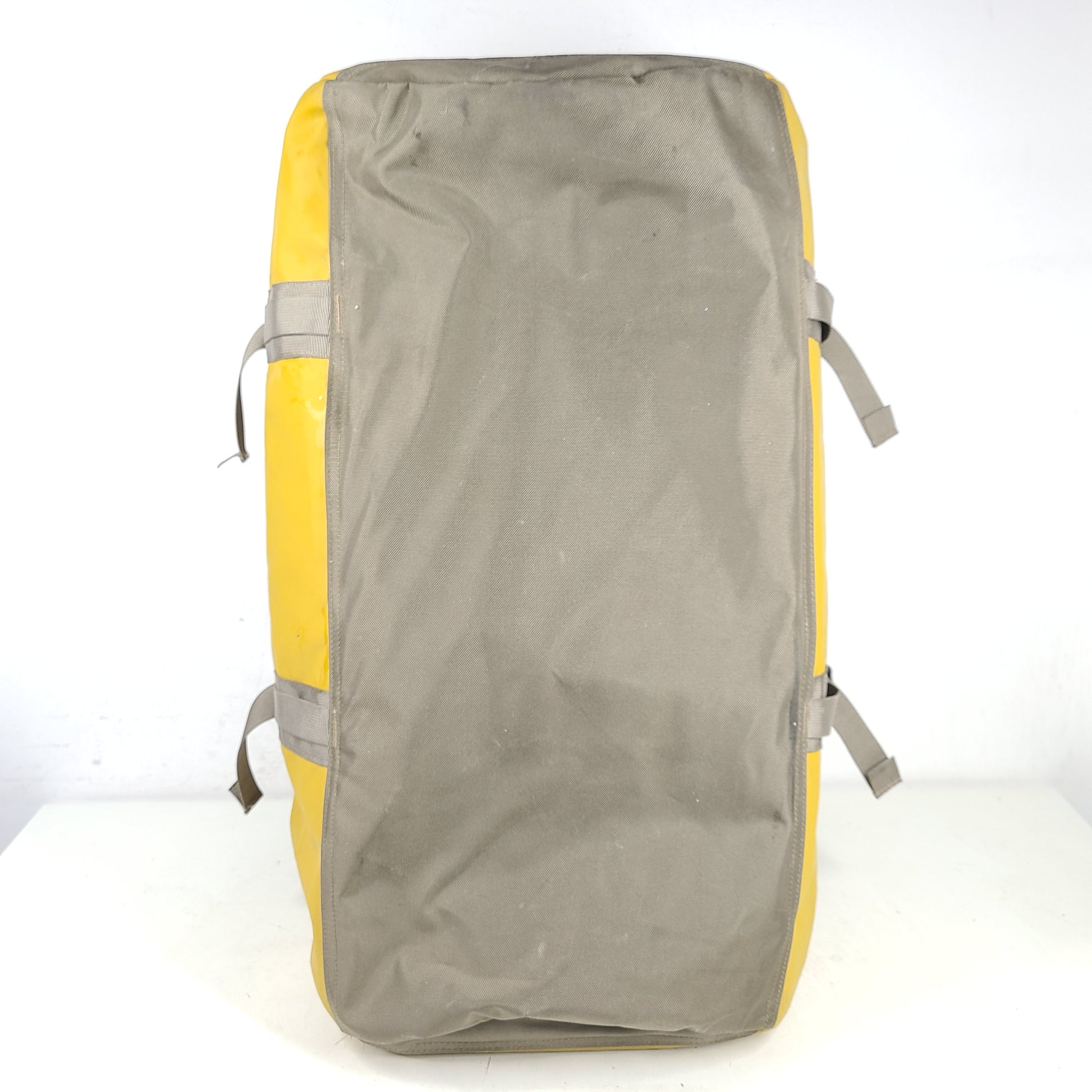 The North Face medium Base Camp duffel in yellow and grey with reinforced handles and adjustable shoulder straps.