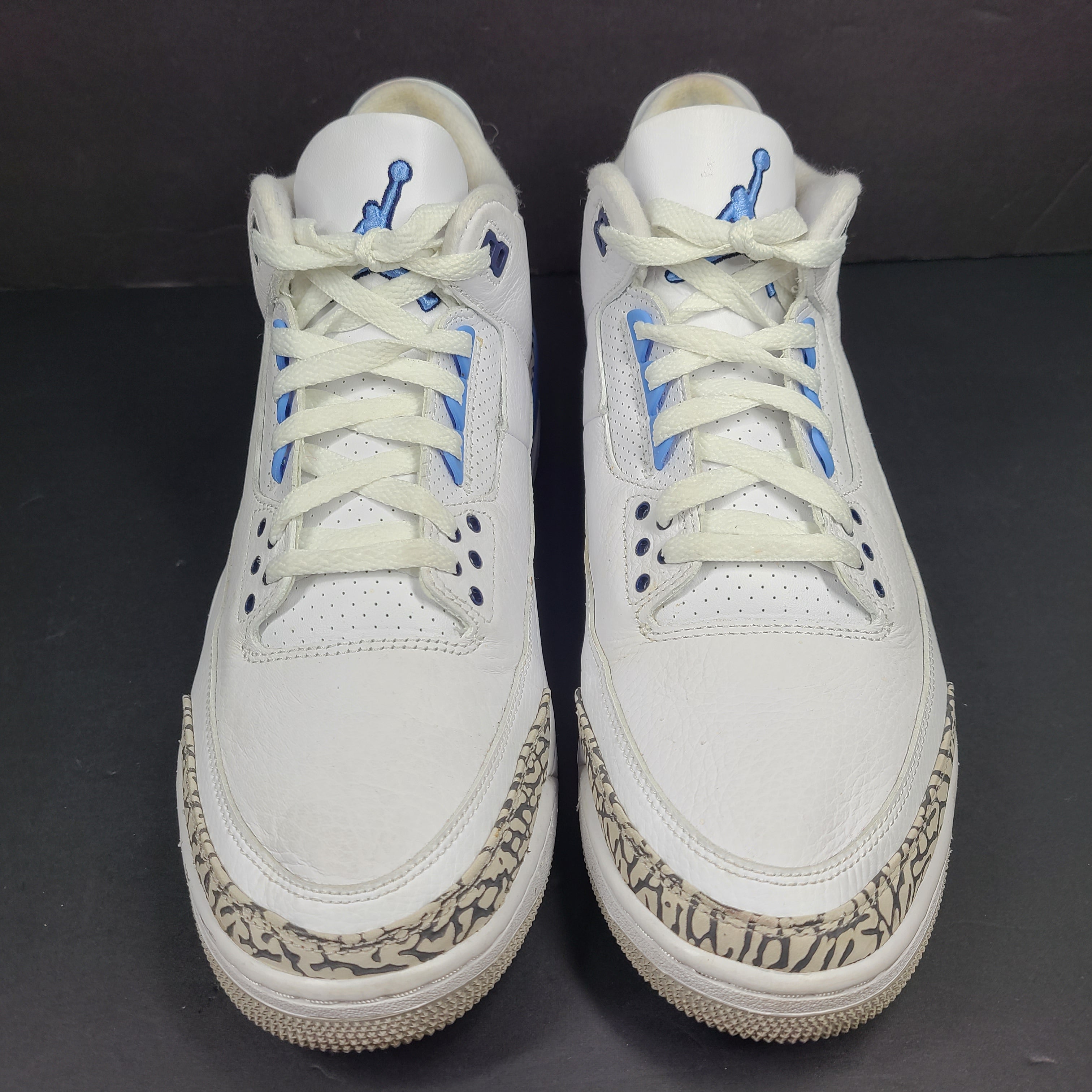 Air Jordan 3 Retro UNC in white and valor blue with elephant-print accents and blue detailing.