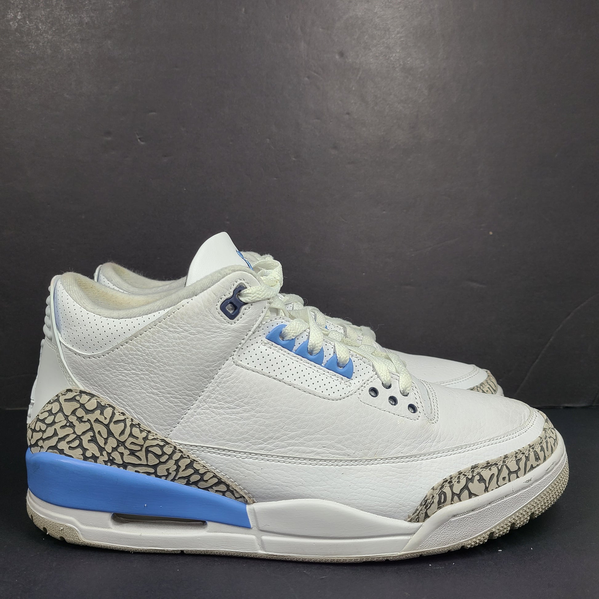 Air Jordan 3 Retro UNC in white and valor blue with elephant-print accents and blue detailing.