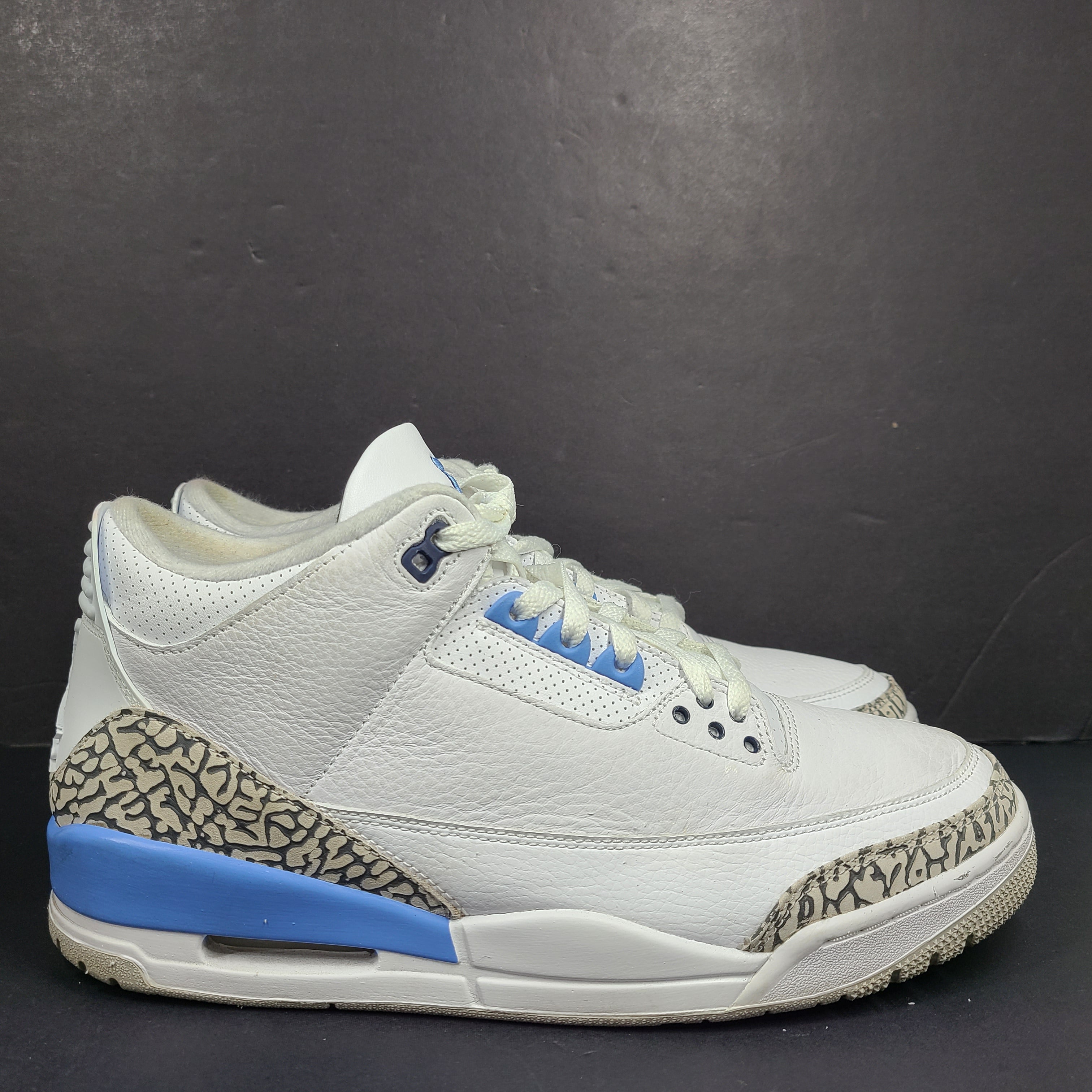 Air Jordan 3 Retro UNC in white and valor blue with elephant-print accents and blue detailing.
