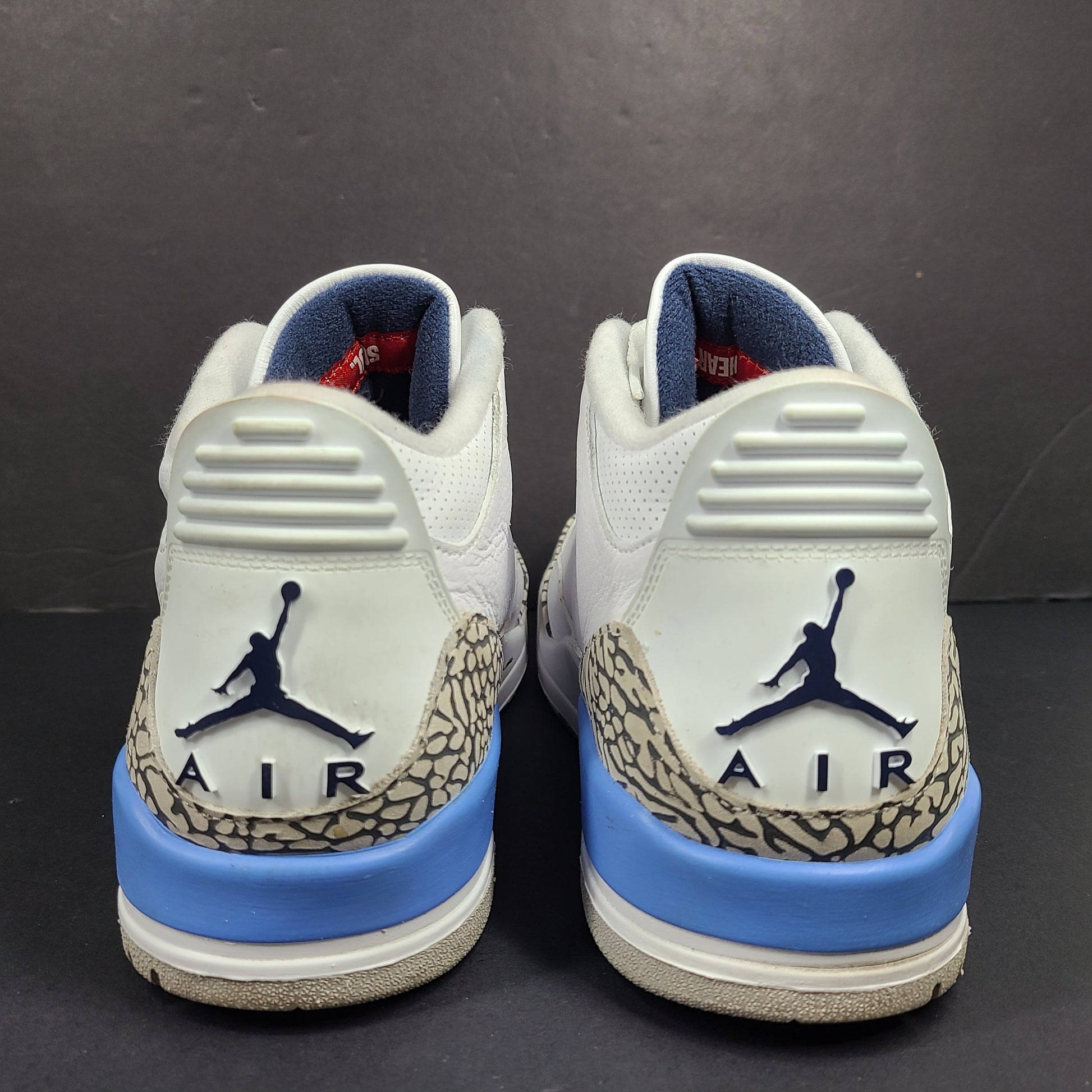 Air Jordan 3 Retro UNC in white and valor blue with elephant-print accents and blue detailing.