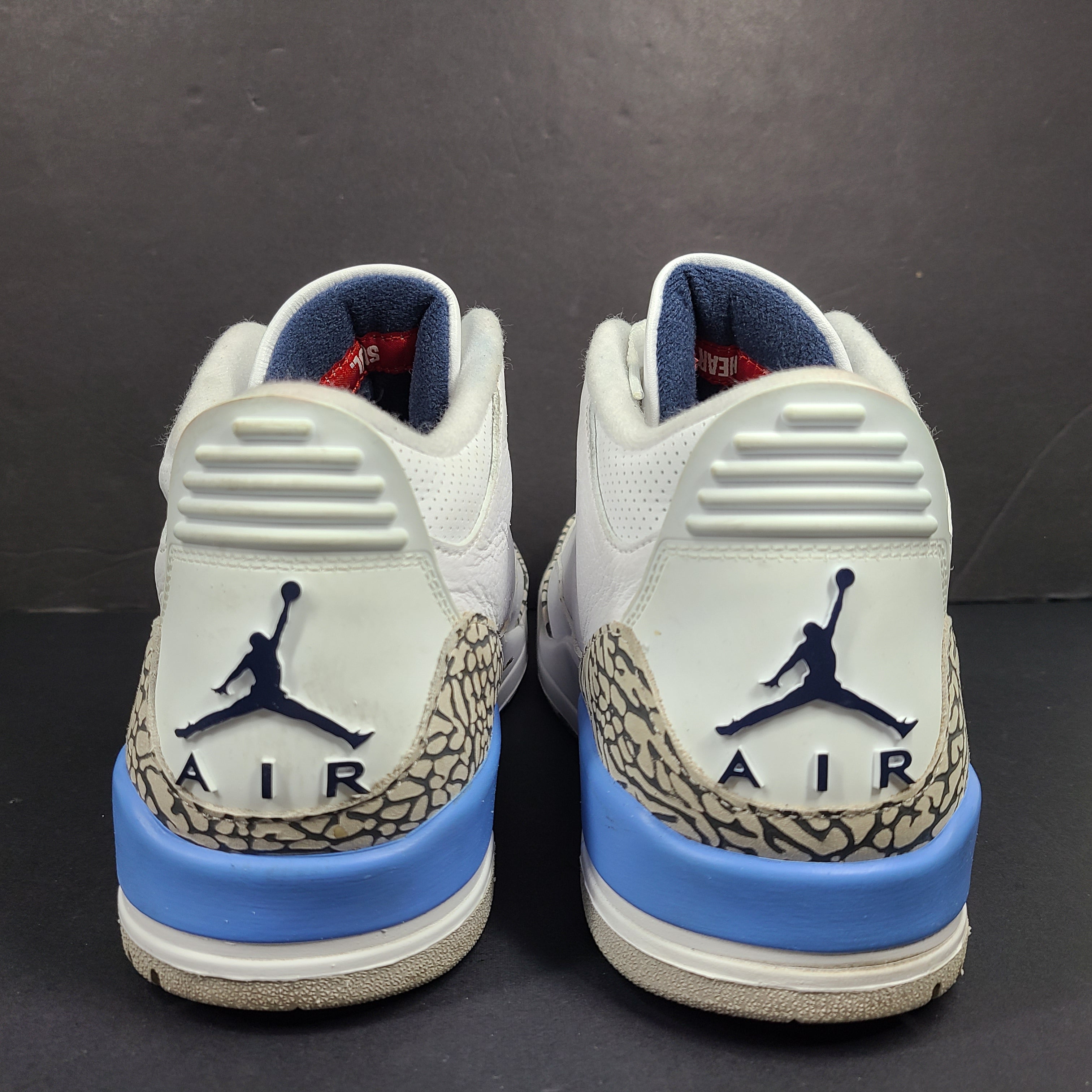 Air Jordan 3 Retro UNC in white and valor blue with elephant-print accents and blue detailing.