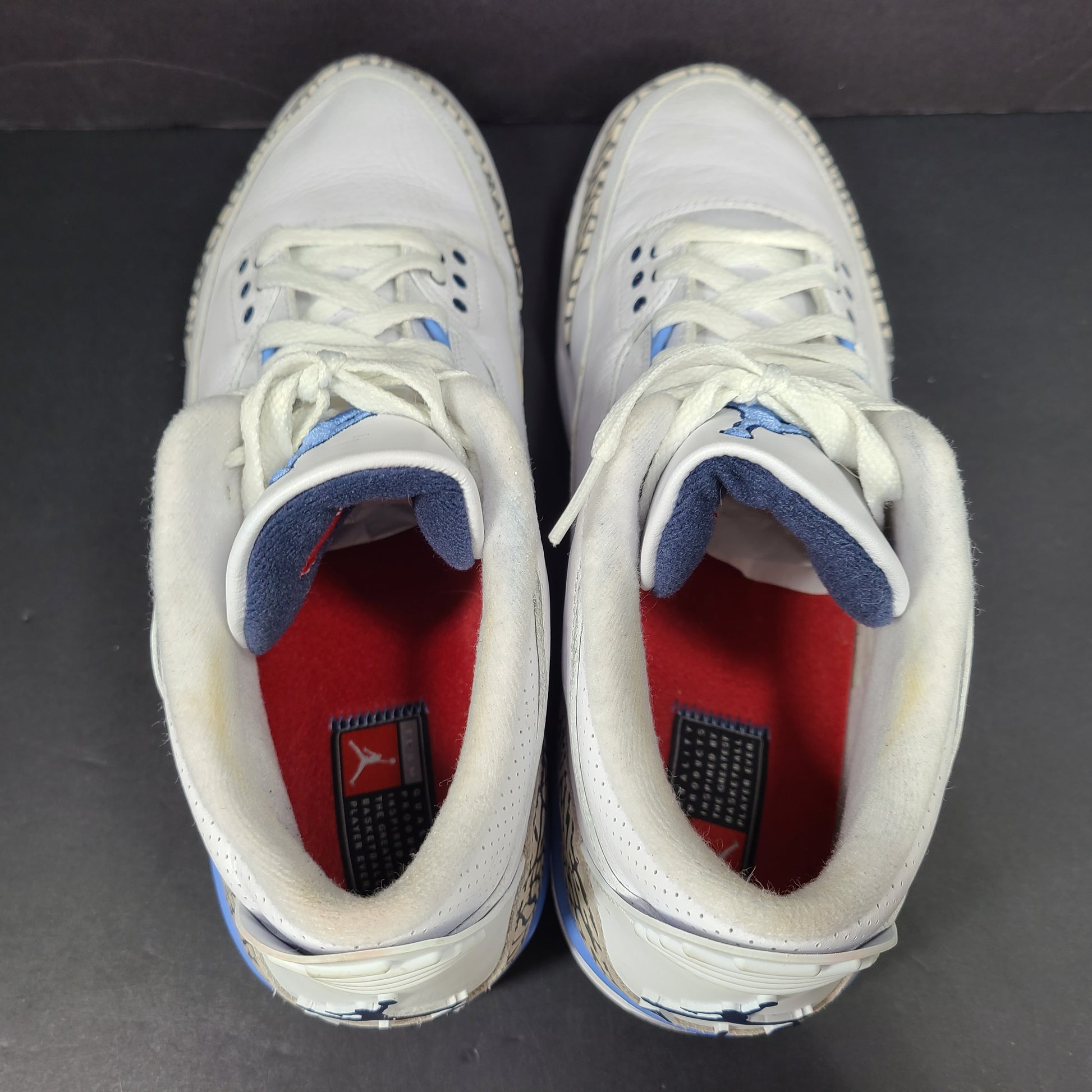 Air Jordan 3 Retro UNC in white and valor blue with elephant-print accents and blue detailing.
