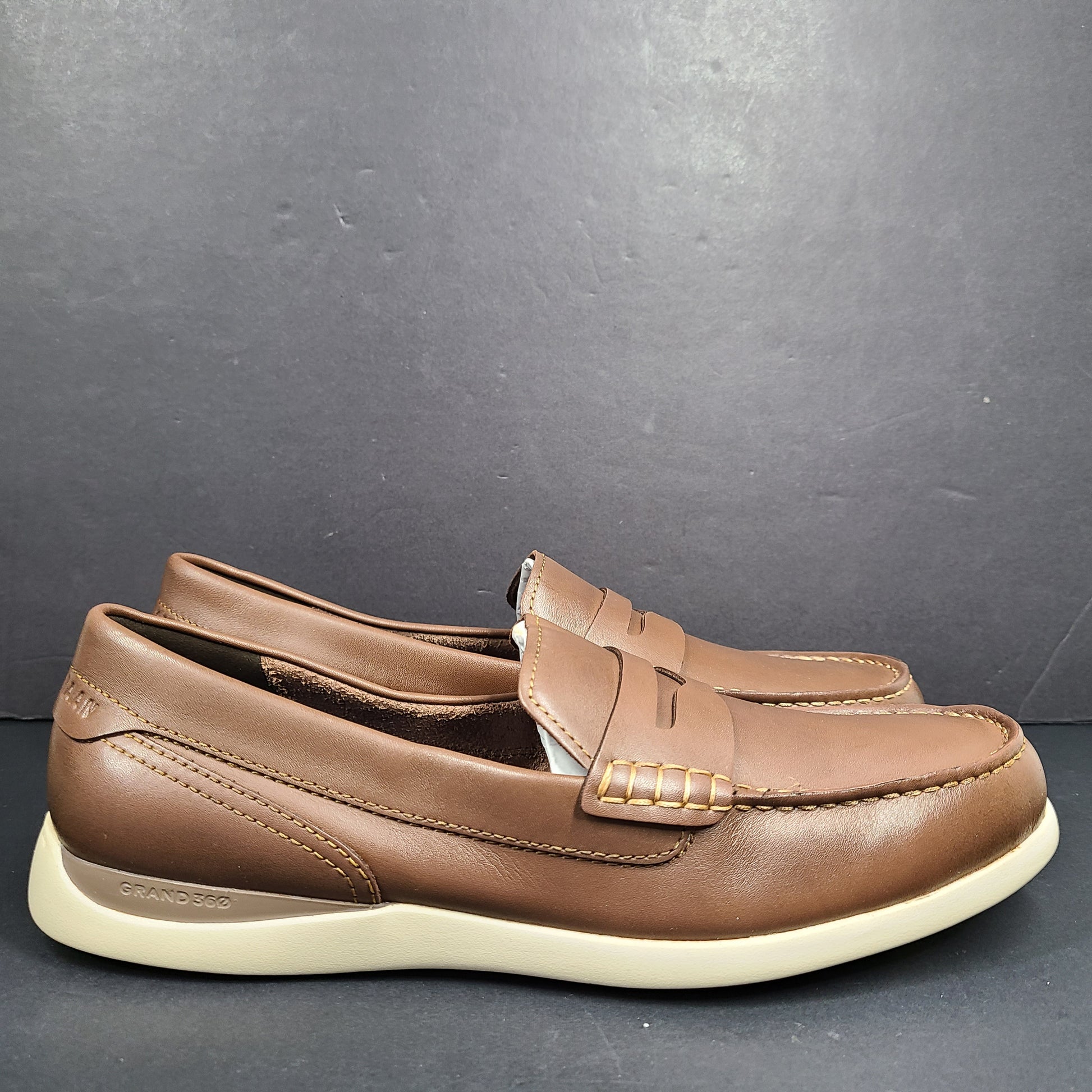 Cole Haan Grand 360 brown penny loafers size 11M, model C33028, with manmade lining.