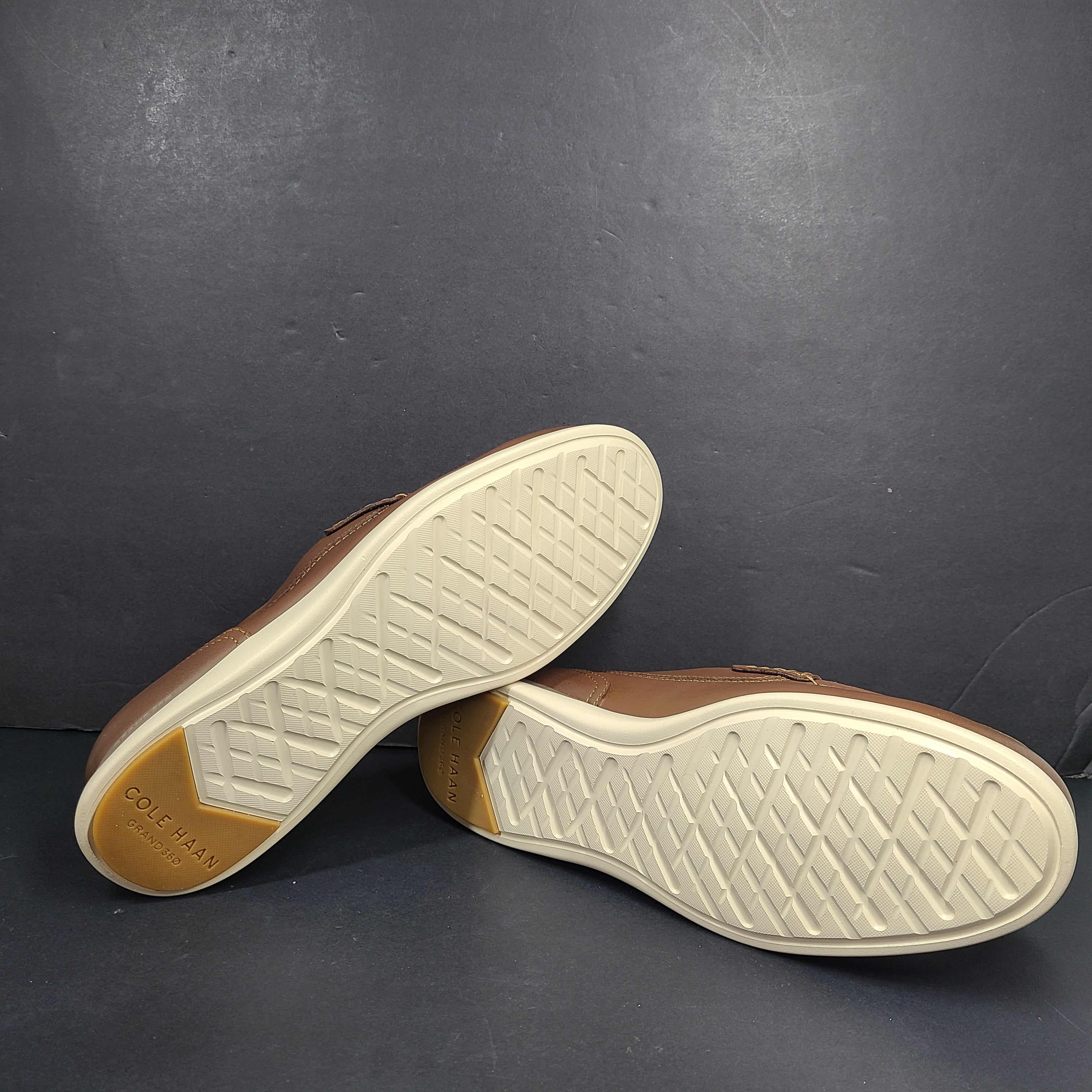 Cole Haan Grand 360 brown penny loafers size 11M, model C33028, with manmade lining.