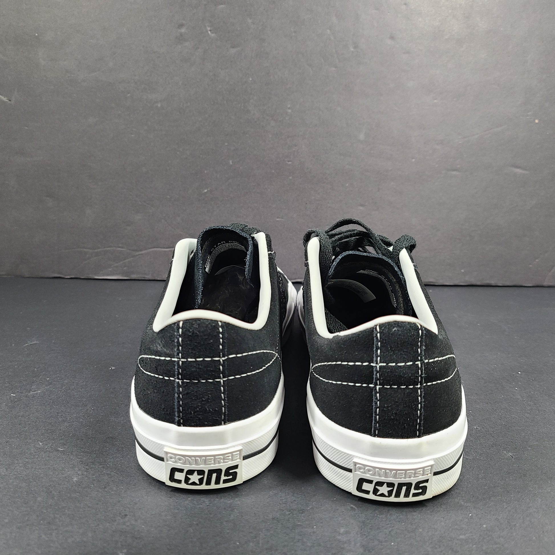 Black and white Converse One Star Pro OX low-top skate shoes in leather with textile lining and a rubber outsole.