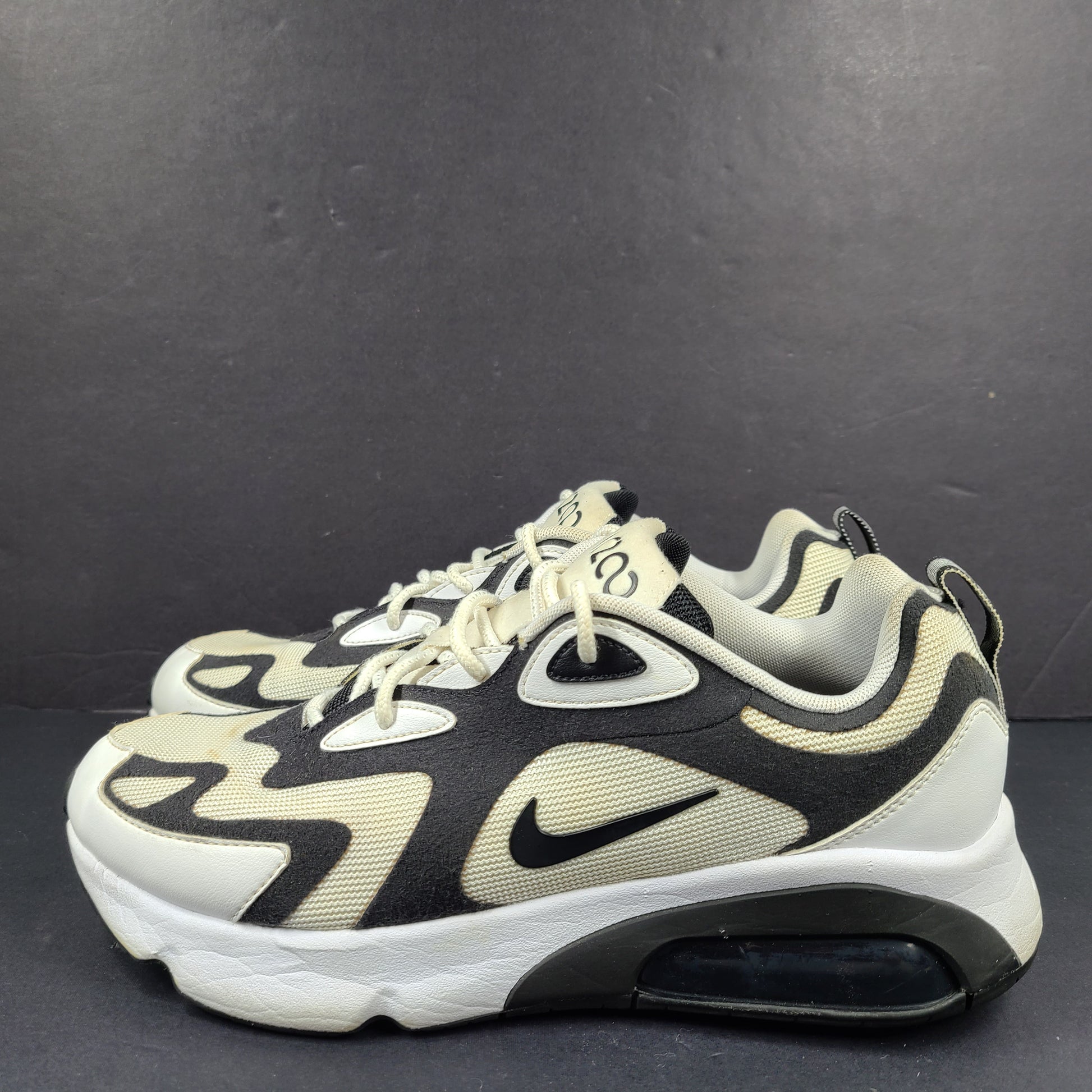 Nike Air Max 200 in black, white and beige with light sole wear and US size 9.5.