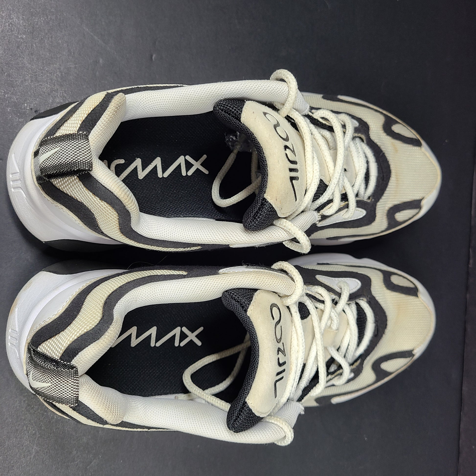 Nike Air Max 200 in black, white and beige with light sole wear and US size 9.5.