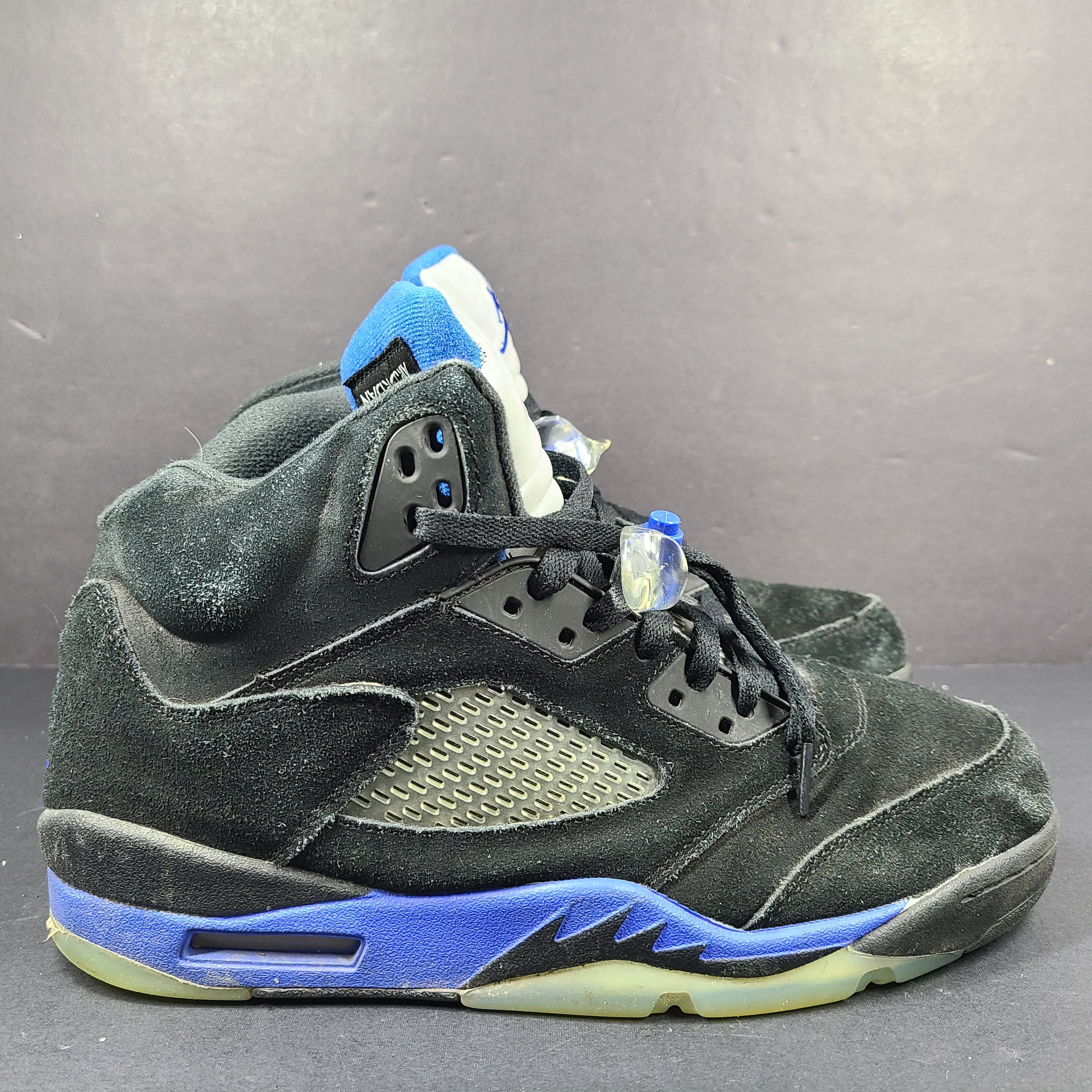 Nike Air Jordan 5 Retro Racer Blue sneakers in black and racer blue, UK 10 with Air Jordan branding on heel and tongue.